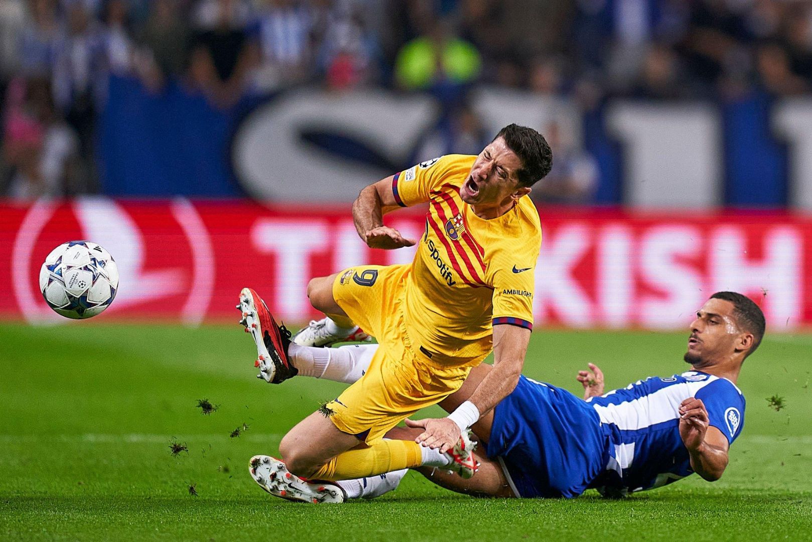 David Carmo of FC Porto competes for the ball with Robert Lewandowski of FC Barcelona during the UEFA Champions League match between FC Porto and FC Barcelona at Estadio do Dragao