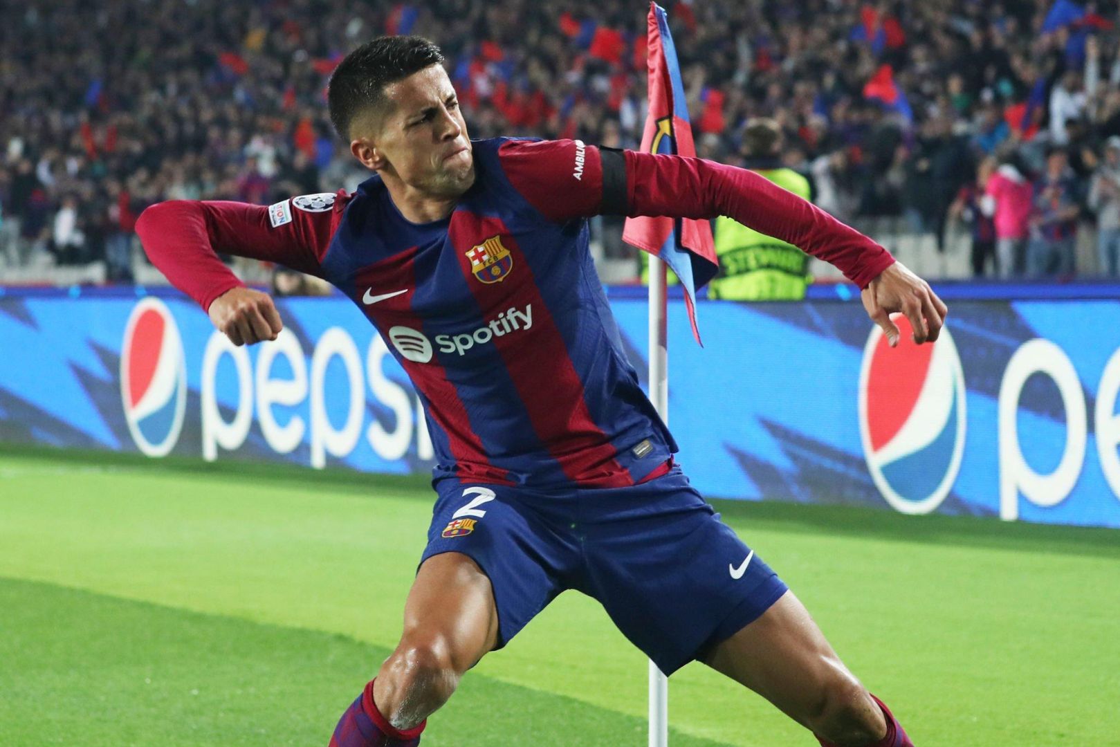 Joao Cancelo is celebrating a goal during the match between FC Barcelona and FC Porto for week 5 of the group stage of the UEFA Champions League, played at the Olympic Stadium Lluis Companys in Barcelona, Spain, on November 28, 2023.