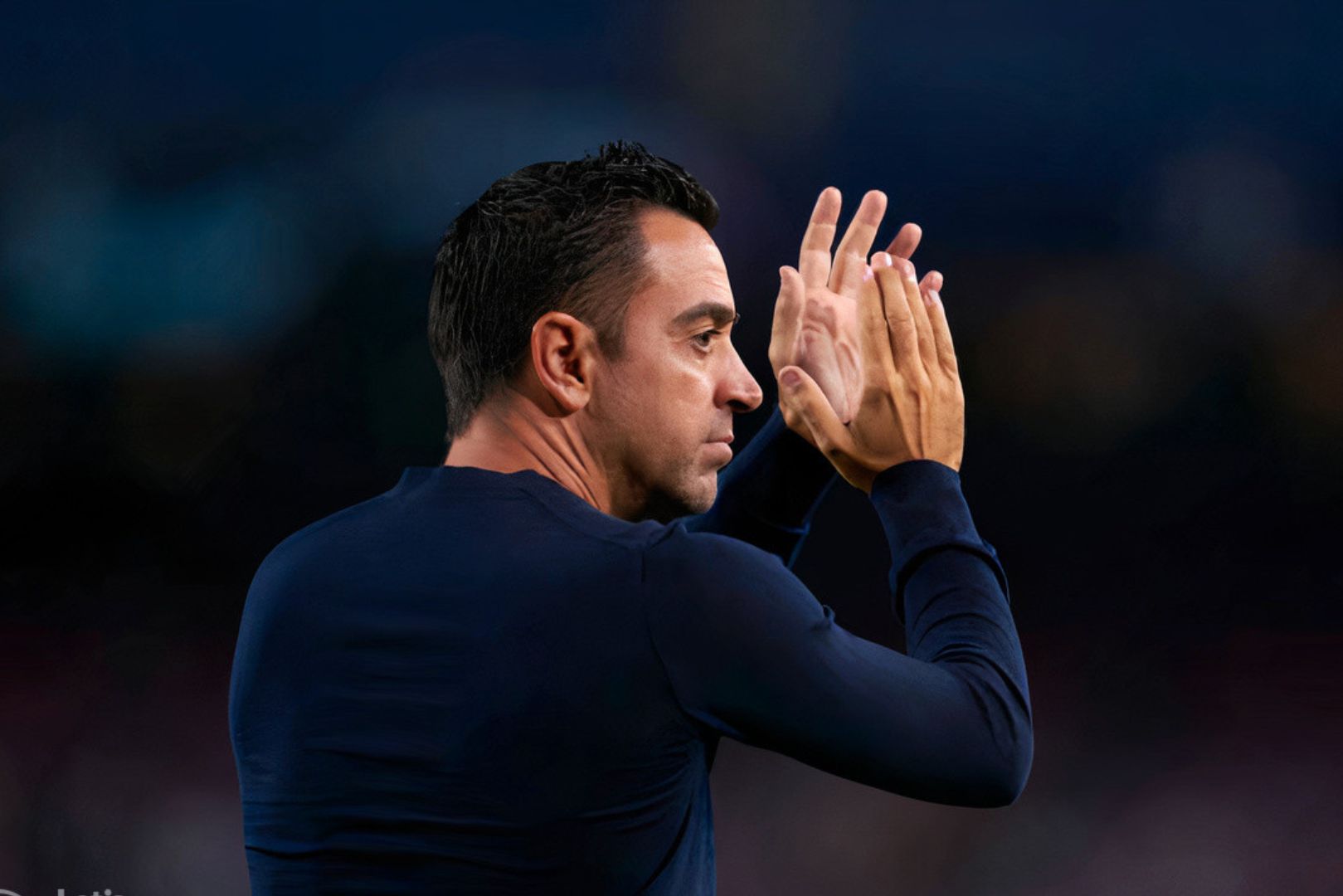BARCELONA, SPAIN - OCTOBER 26: Xavi Hernandez, Manager of FC Barcelona applauds the fans following their side's defeat and elimination from the UEFA Champions League in the UEFA Champions League group C match between FC Barcelona and FC Bayern München at Spotify Camp Nou on October 26, 2022 in Barcelona, Spain.