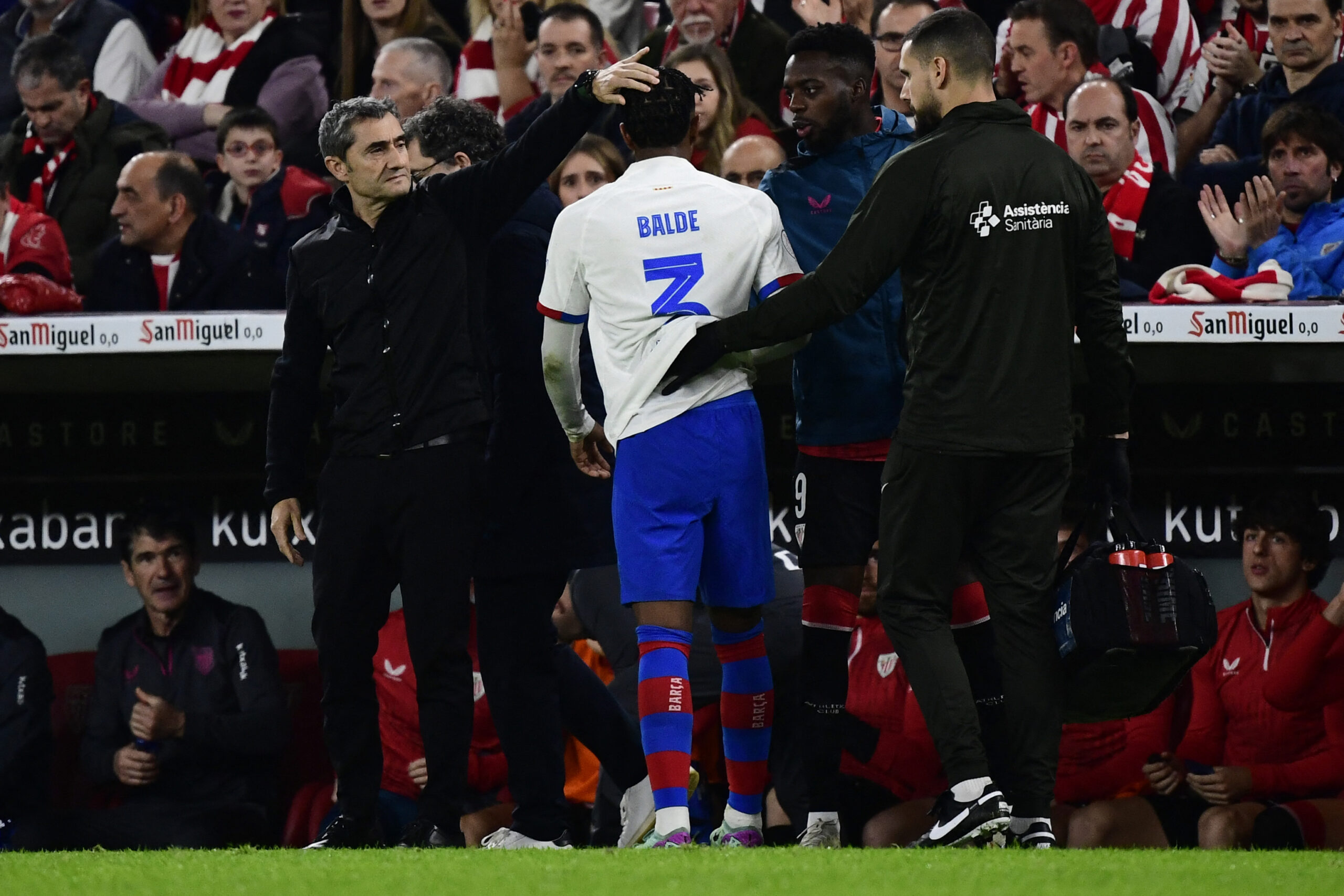 Barcelona's Spanish defender #03 Alejandro Balde leaves after resulting injured during the Spanish Copa del Rey (King's Cup) quarter final football match between Athletic Club Bilbao and FC Barcelona at the San Mames stadium in Bilbao on January 24, 2024.