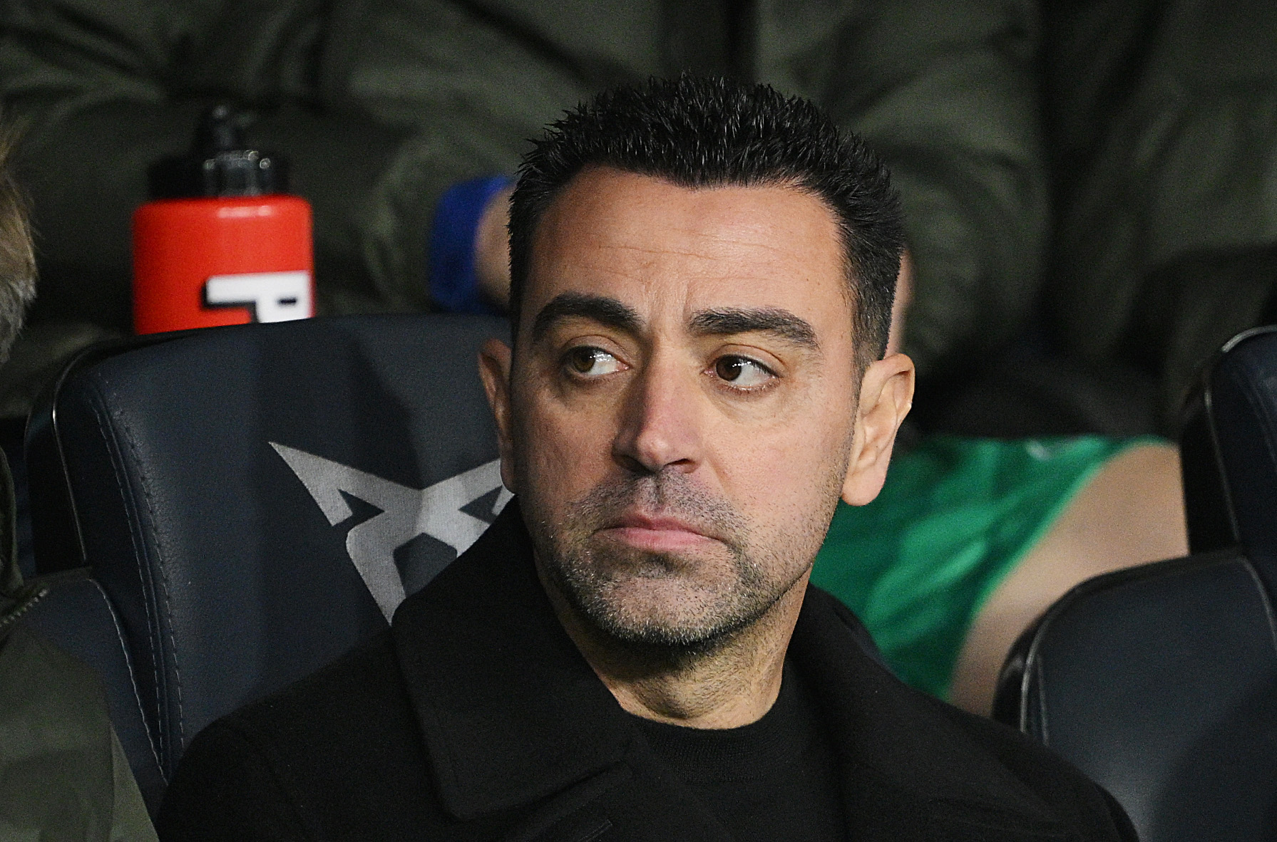 BARCELONA, SPAIN - JANUARY 27: Xavi, Head Coach of FC Barcelona, looks on from the dugout prior to the LaLiga EA Sports match between FC Barcelona and Villarreal CF at Estadi Olimpic Lluis Companys on January 27, 2024 in Barcelona, Spain.