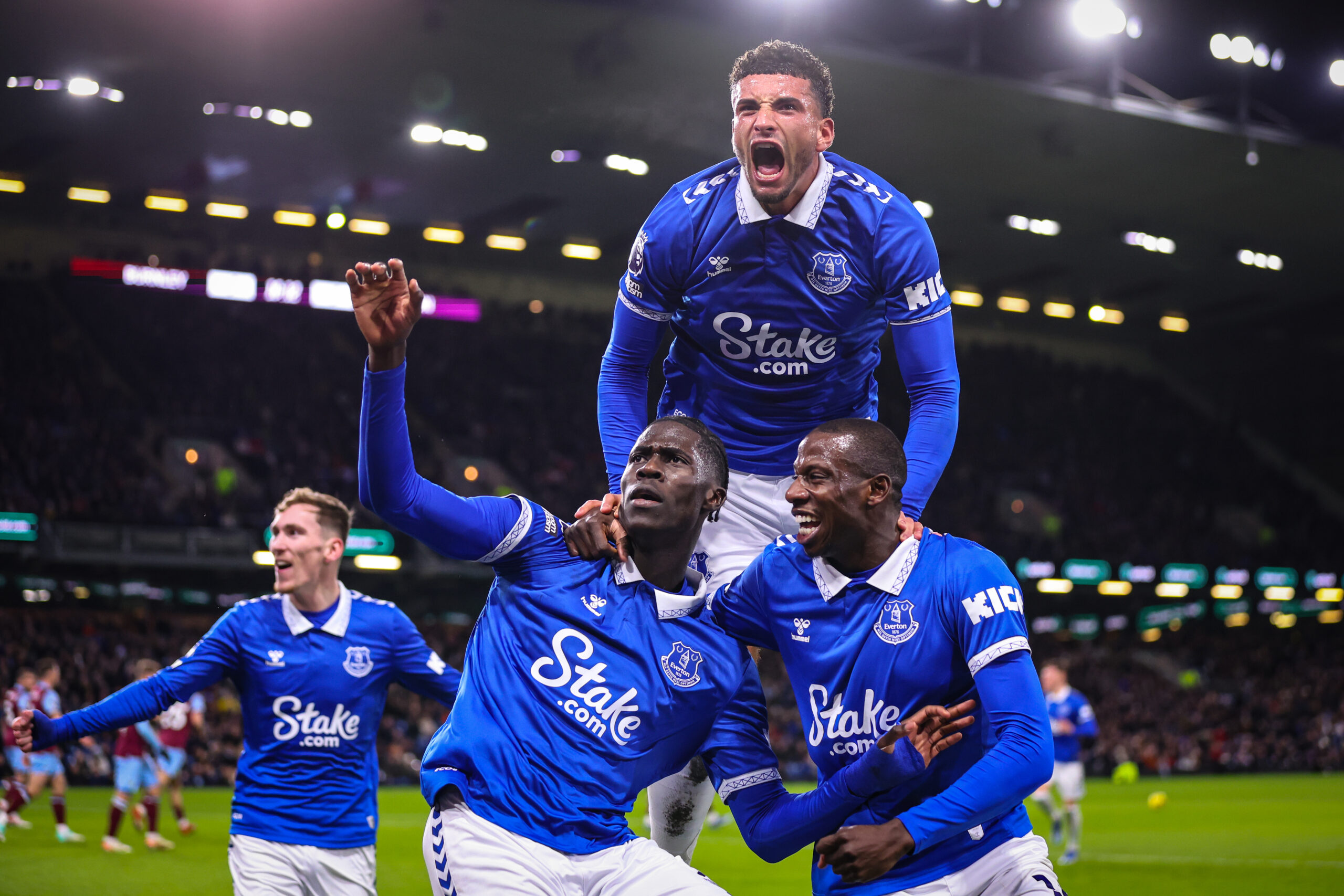 BURNLEY, ENGLAND - DECEMBER 16: Amadou Onana of Everton celebrates with Abdoulaye Doucoure and Ben Godfrey after scoring their team's first goal during the Premier League match between Burnley FC and Everton FC at Turf Moor on December 16, 2023 in Burnley, England.