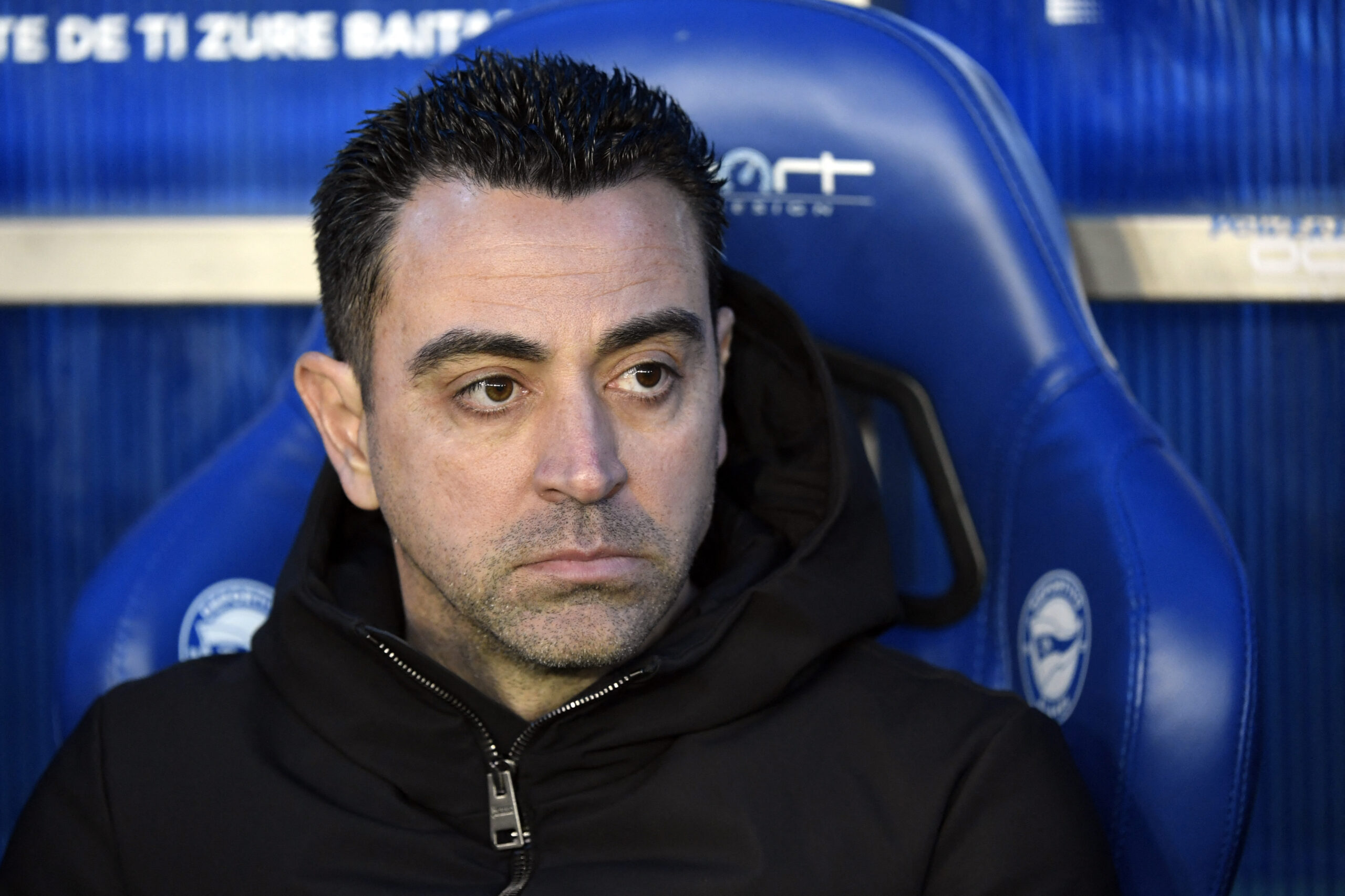 Barcelona's Spanish coach Xavi is pictured sitting on the bench prior to the Spanish league football match between Deportivo Alaves and FC Barcelona at the Mendizorroza stadium in Vitoria on February 3, 2024.