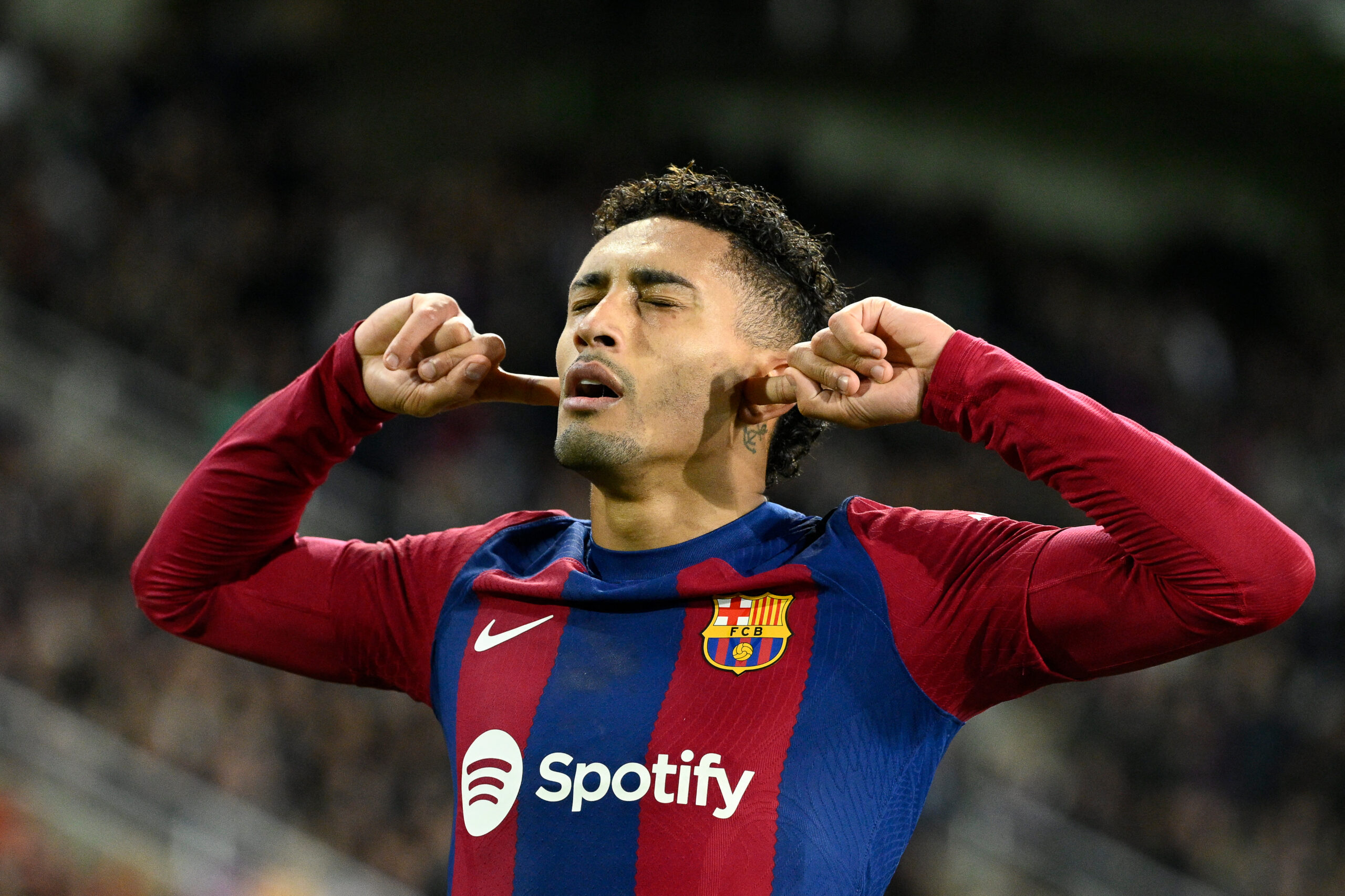 Barcelona's Brazilian forward #11 Raphinha celebrates after scoring his team's first goal during the Spanish league football match between FC Barcelona and UD Almeria at the Estadi Olimpic Lluis Companys in Barcelona on December 20, 2023.
