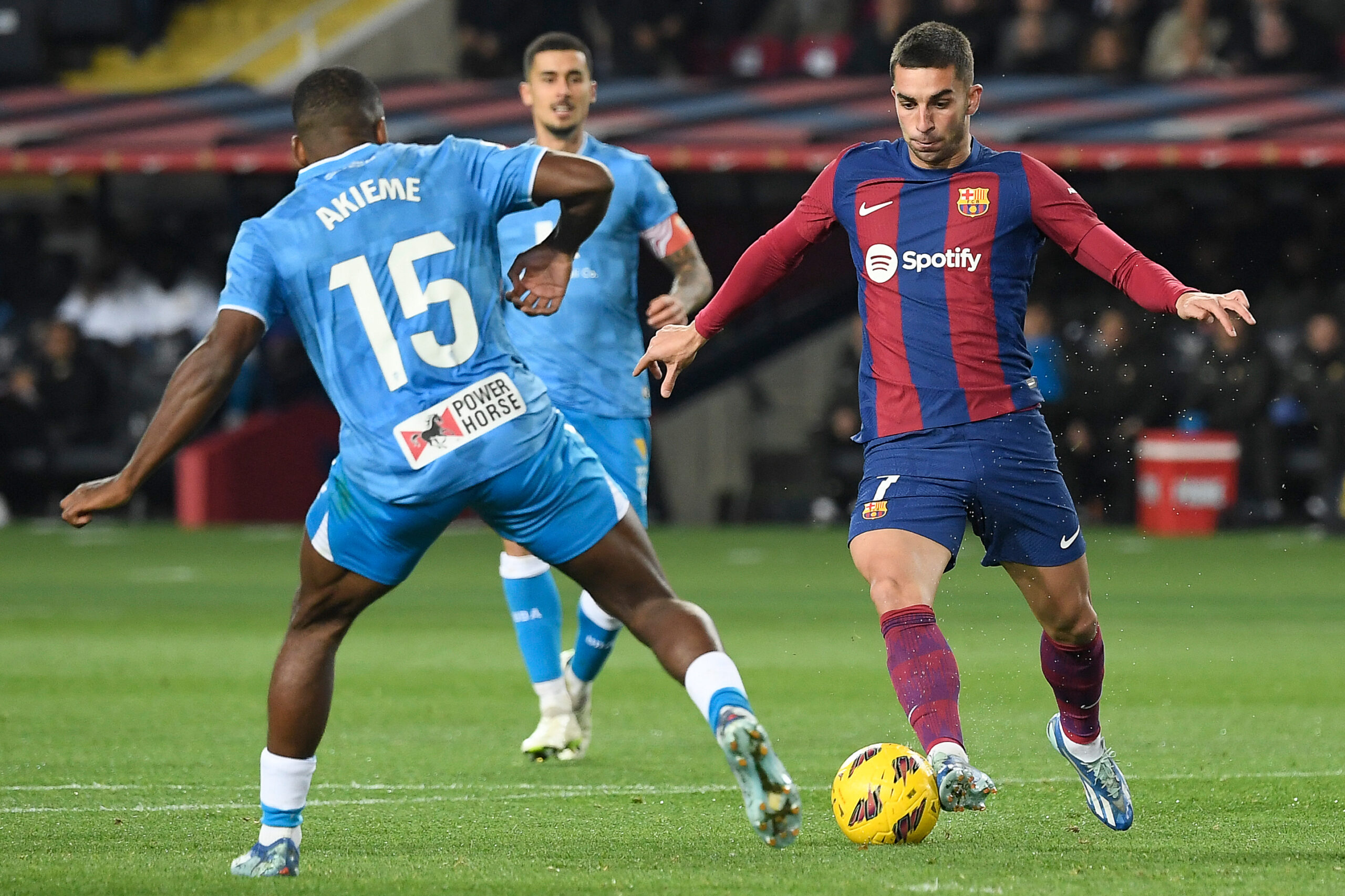 Barcelona's Spanish forward #07 Ferran Torres fights for the ball with Almeria's Spanish defender #15 Sergio Akieme during the Spanish league football match between FC Barcelona and UD Almeria at the Estadi Olimpic Lluis Companys in Barcelona on December 20, 2023.
