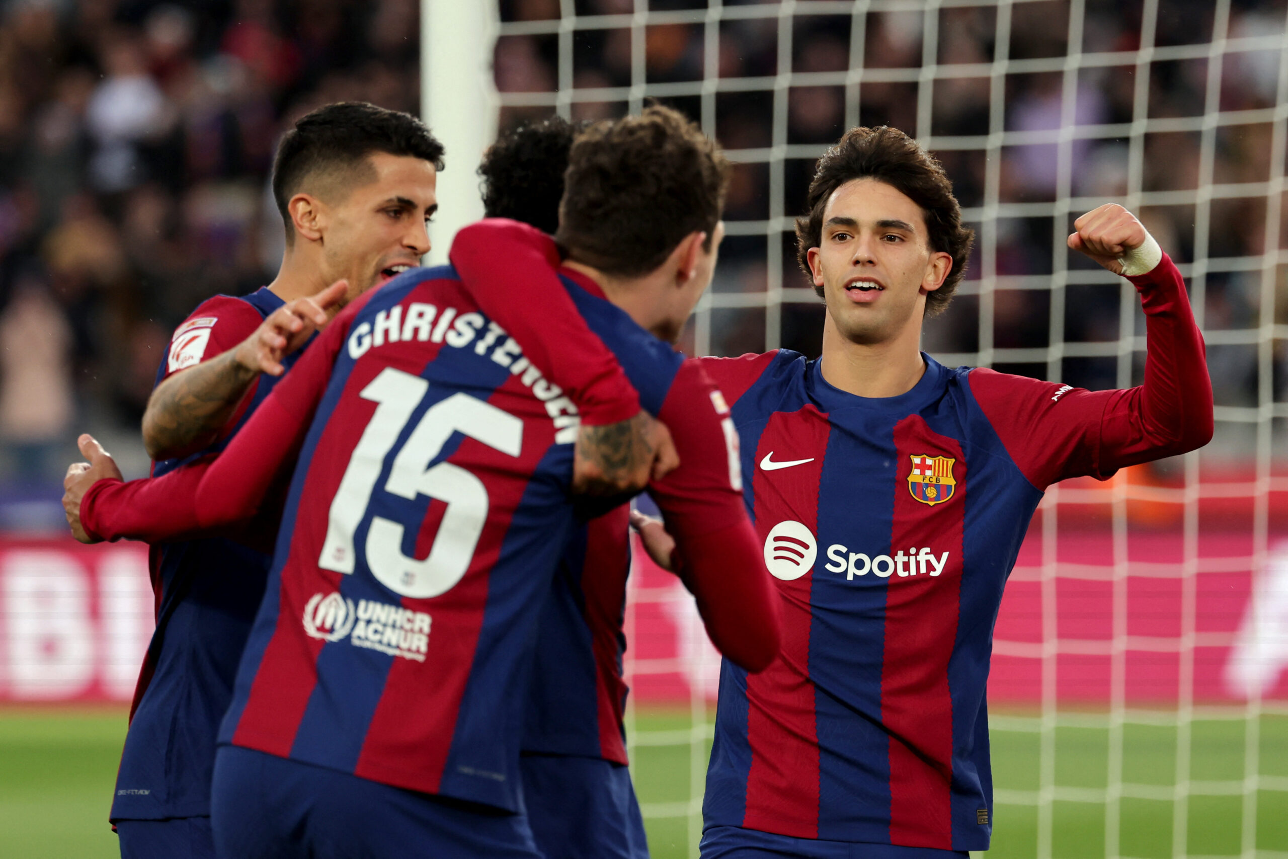 Barcelona's Portuguese forward #14 Joao Felix celebrates with teammates scoring his team's second goal during the Spanish league football match between FC Barcelona and Getafe CF at the Estadi Olimpic Lluis Companys in Barcelona on February 24, 2024.
