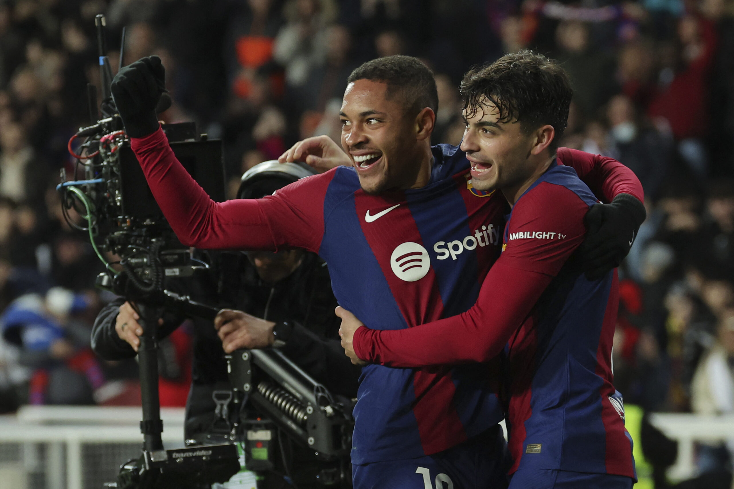Barcelona's Brazilian forward #19 Vitor Roque (L) celebrates scoring the opening goal, with Barcelona's Spanish midfielder #08 Pedri, during the Spanish league football match between FC Barcelona and CA Osasuna at the Estadi Olimpic Lluis Companys in Barcelona on January 31, 2024.