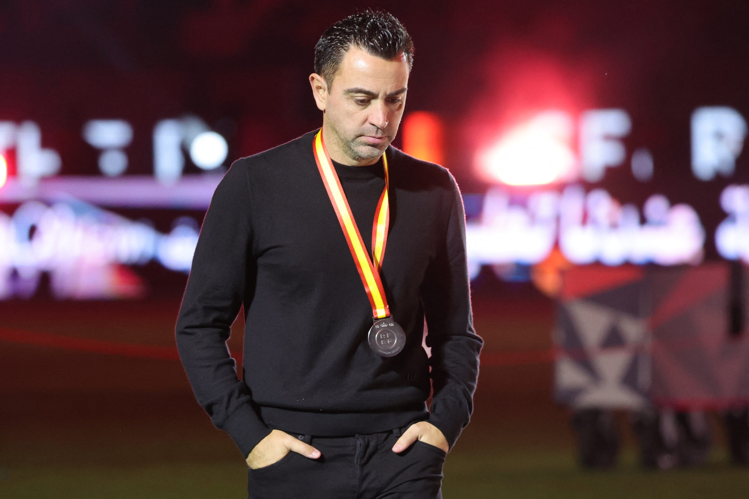 Barcelona's Spanish coach Xavi walks during the medal ceremony after the Spanish Super Cup final football match between Real Madrid and Barcelona at the Al-Awwal Park Stadium in Riyadh, on January 14, 2024.