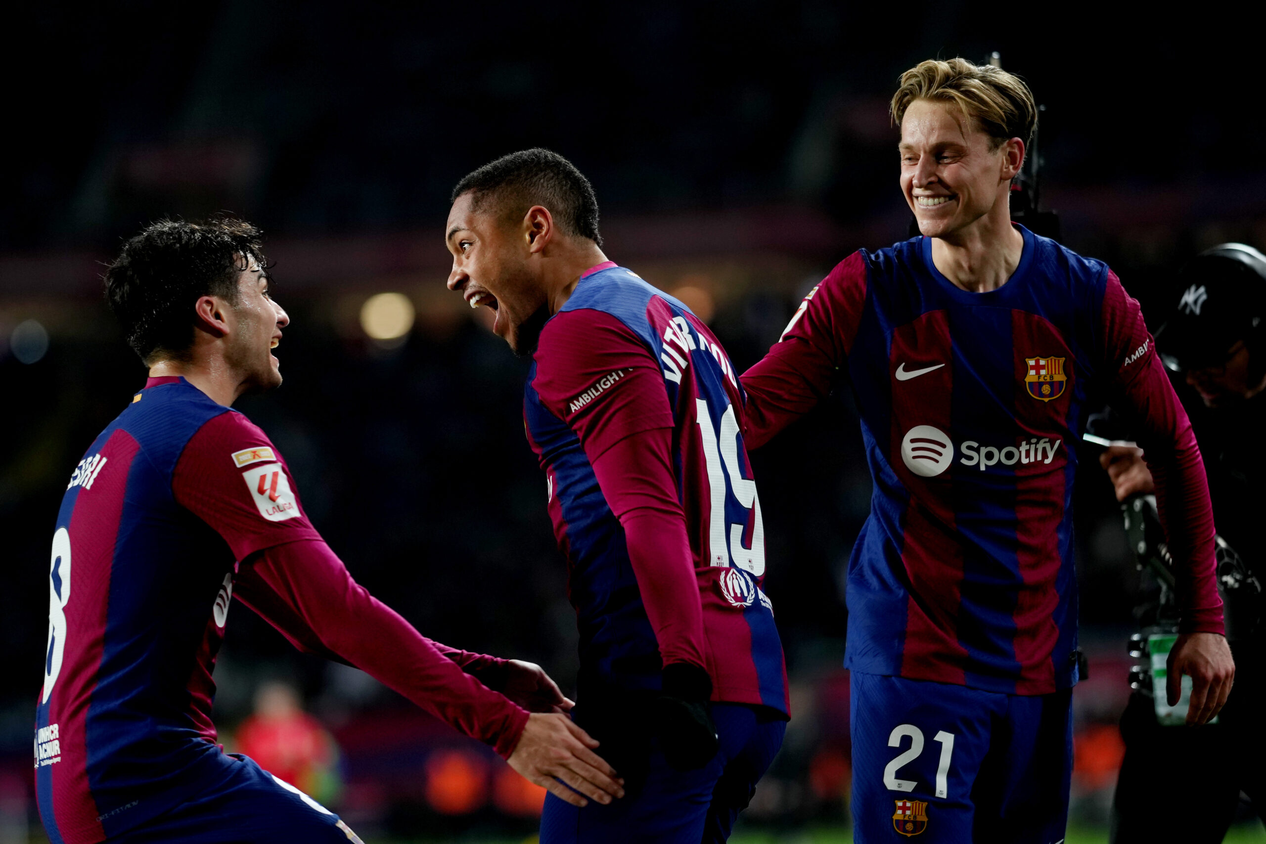 BARCELONA, SPAIN - JANUARY 31: Vitor Roque of FC Barcelona celebrates scoring his team's first goal with teammates Joao Cancelo and Frenkie de Jong during the LaLiga EA Sports match between FC Barcelona and CA Osasuna at Estadi Olimpic Lluis Companys on January 31, 2024 in Barcelona, Spain.