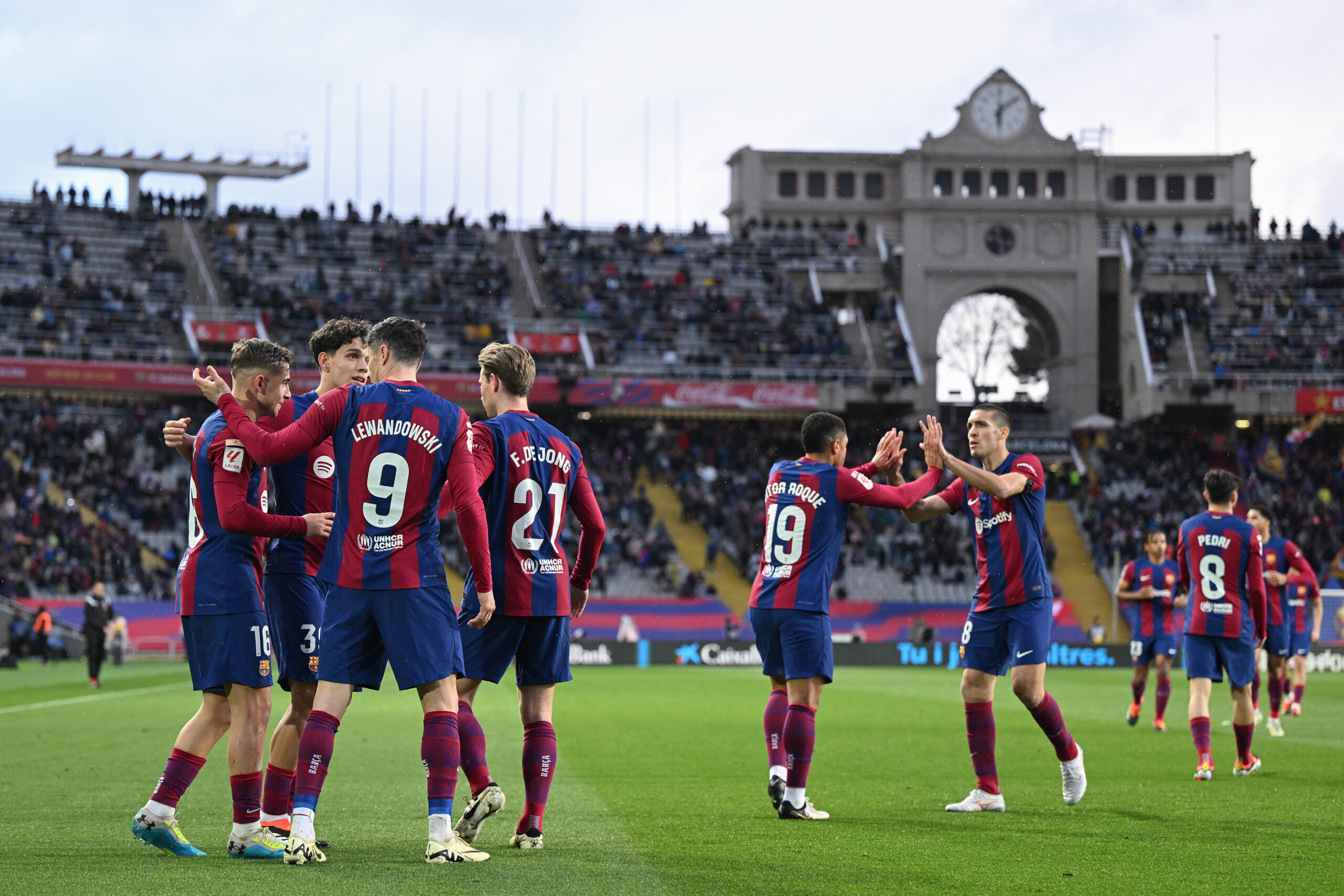 BARCELONA, SPAIN - FEBRUARY 24: Fermin Lopez (L) of FC Barcelona celebrates with his team mates after scoring his team's fourth goal during the LaLiga EA Sports match between FC Barcelona and Getafe CF at Estadi Olimpic Lluis Companys on February 24, 2024 in Barcelona, Spain.