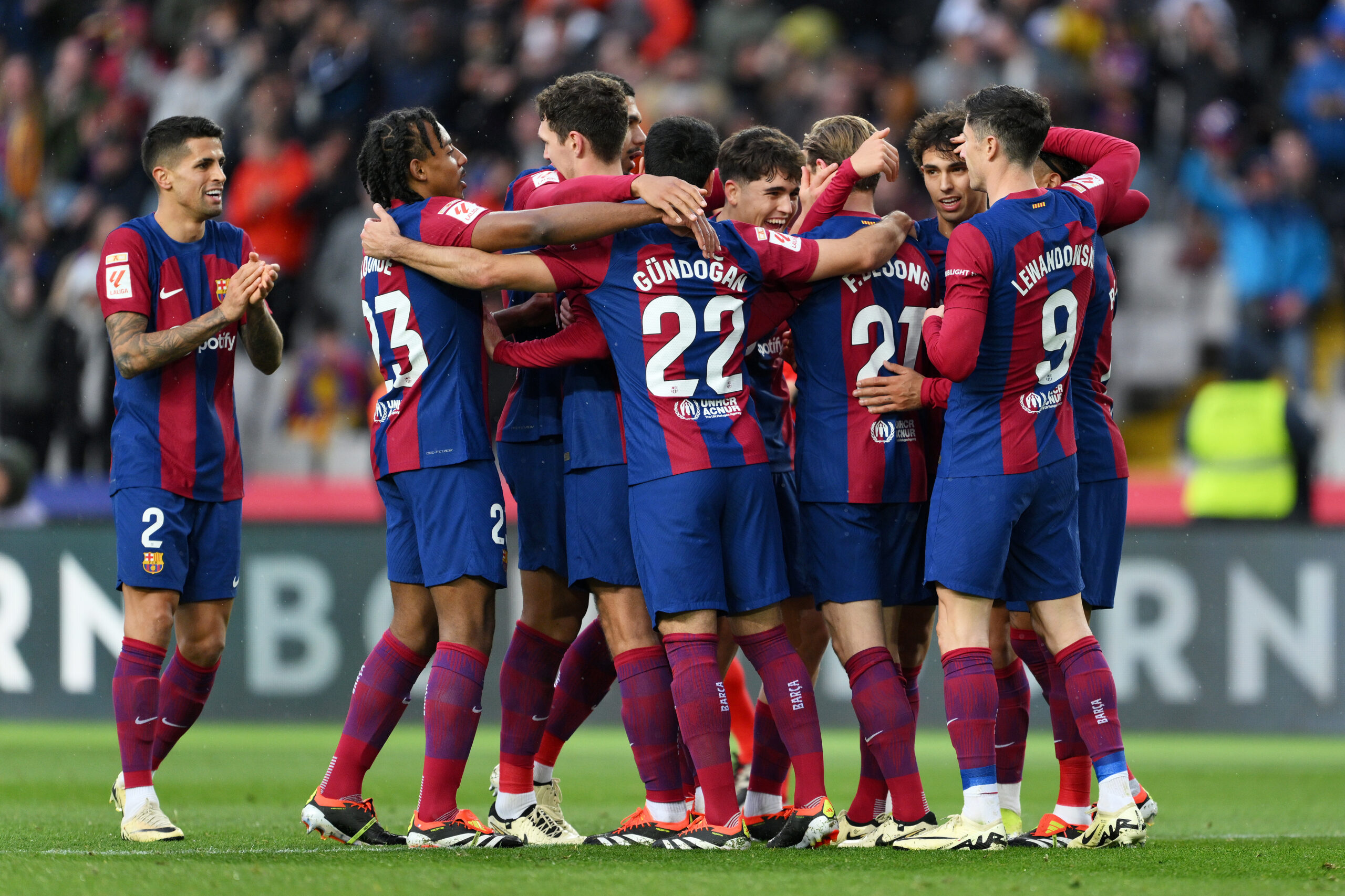 BARCELONA, SPAIN - FEBRUARY 24: Frenkie de Jong of FC Barcelona (obscured) celebrates with team mates after scoring his team's third goal during the LaLiga EA Sports match between FC Barcelona and Getafe CF at Estadi Olimpic Lluis Companys on February 24, 2024 in Barcelona, Spain.