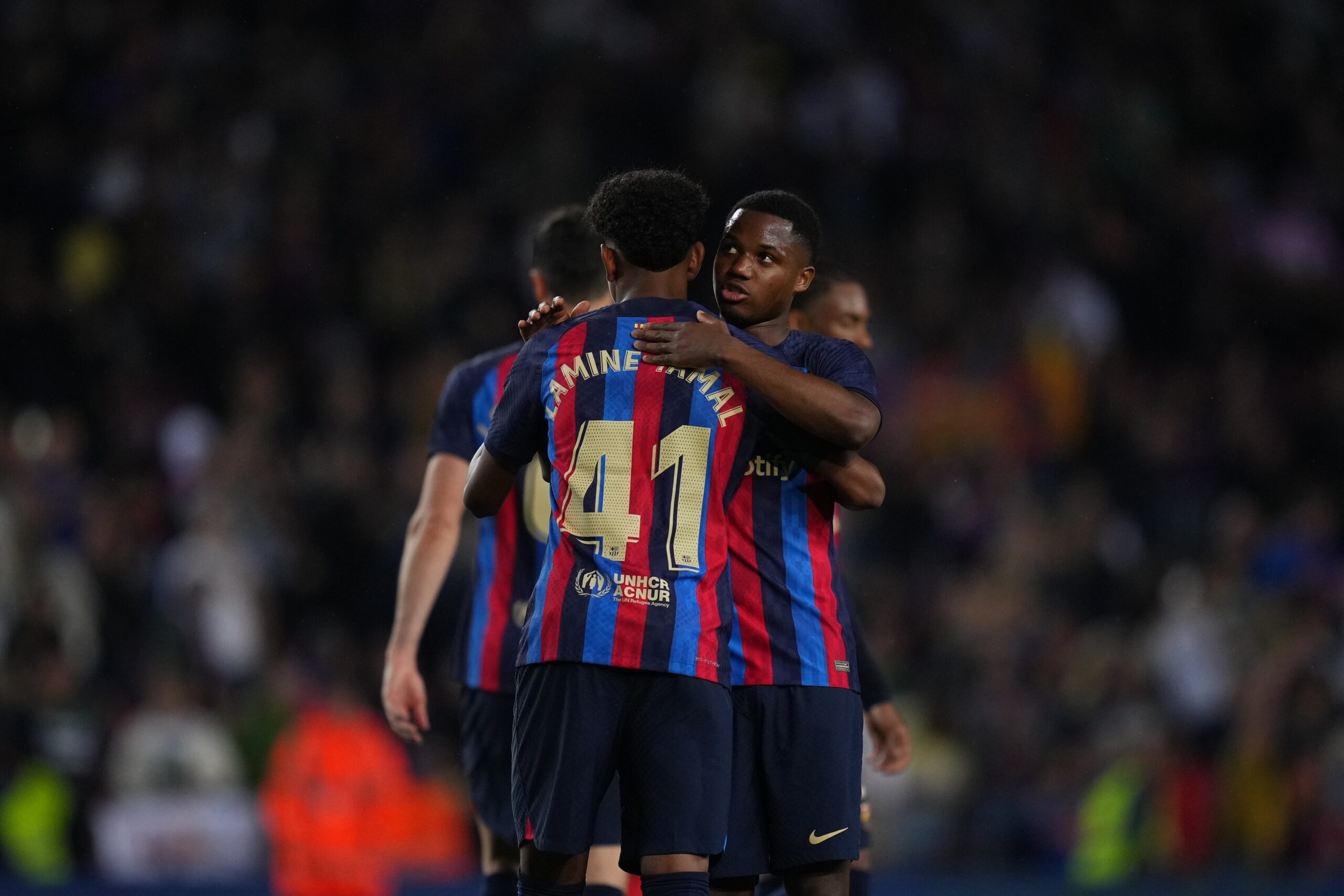 BARCELONA, SPAIN - APRIL 29: Ansu Fati of FC Barcelona embraces teammate Lamine Yamal during the LaLiga Santander match between FC Barcelona and Real Betis at Spotify Camp Nou on April 29, 2023 in Barcelona, Spain.
