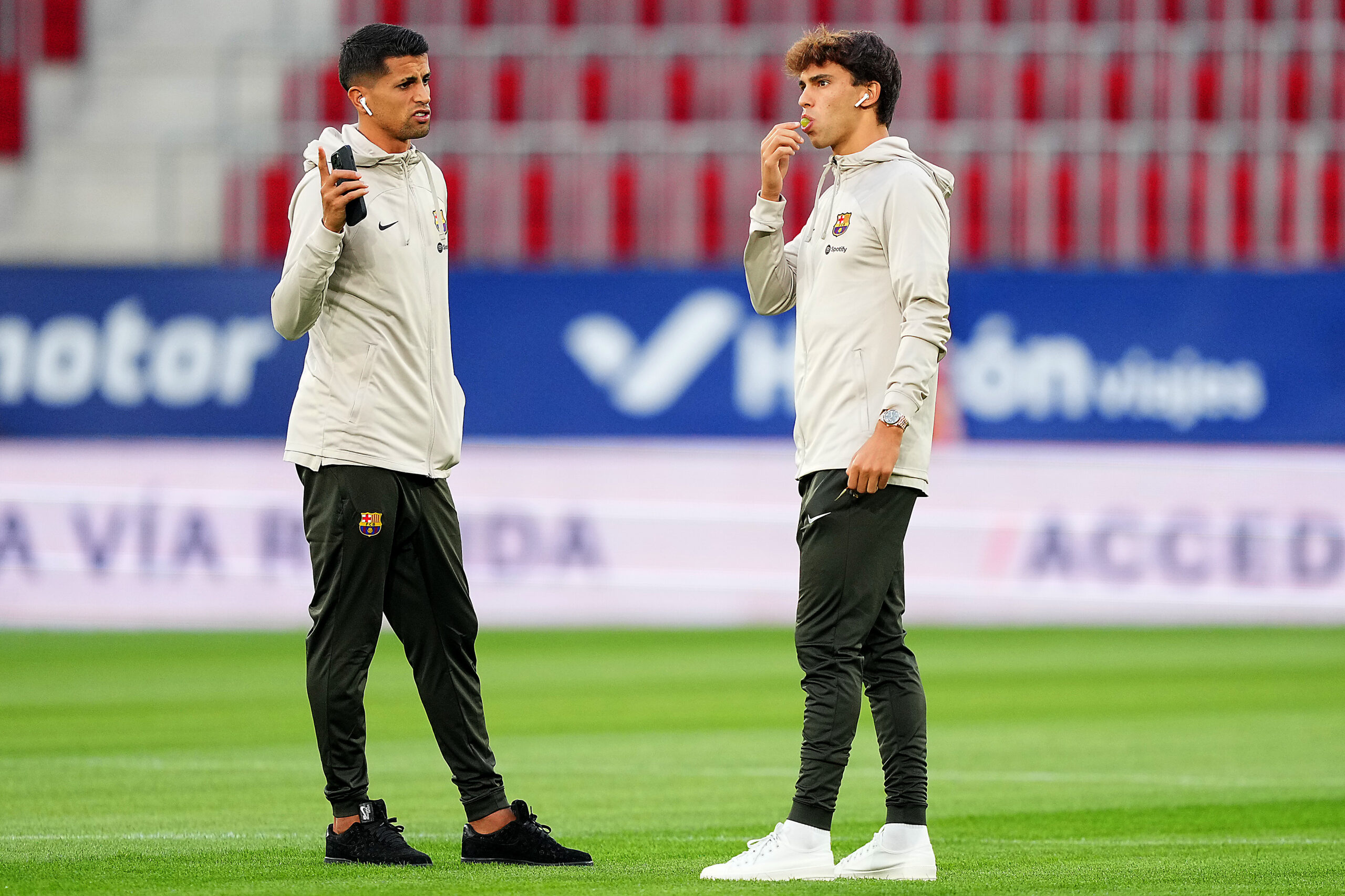 PAMPLONA, SPAIN - SEPTEMBER 03: Joao Felix and Joao Cancelo of FC Barcelona inspect the pitch prior to the LaLiga EA Sports match between CA Osasuna and FC Barcelona at Estadio El Sadar on September 03, 2023 in Pamplona, Spain.
