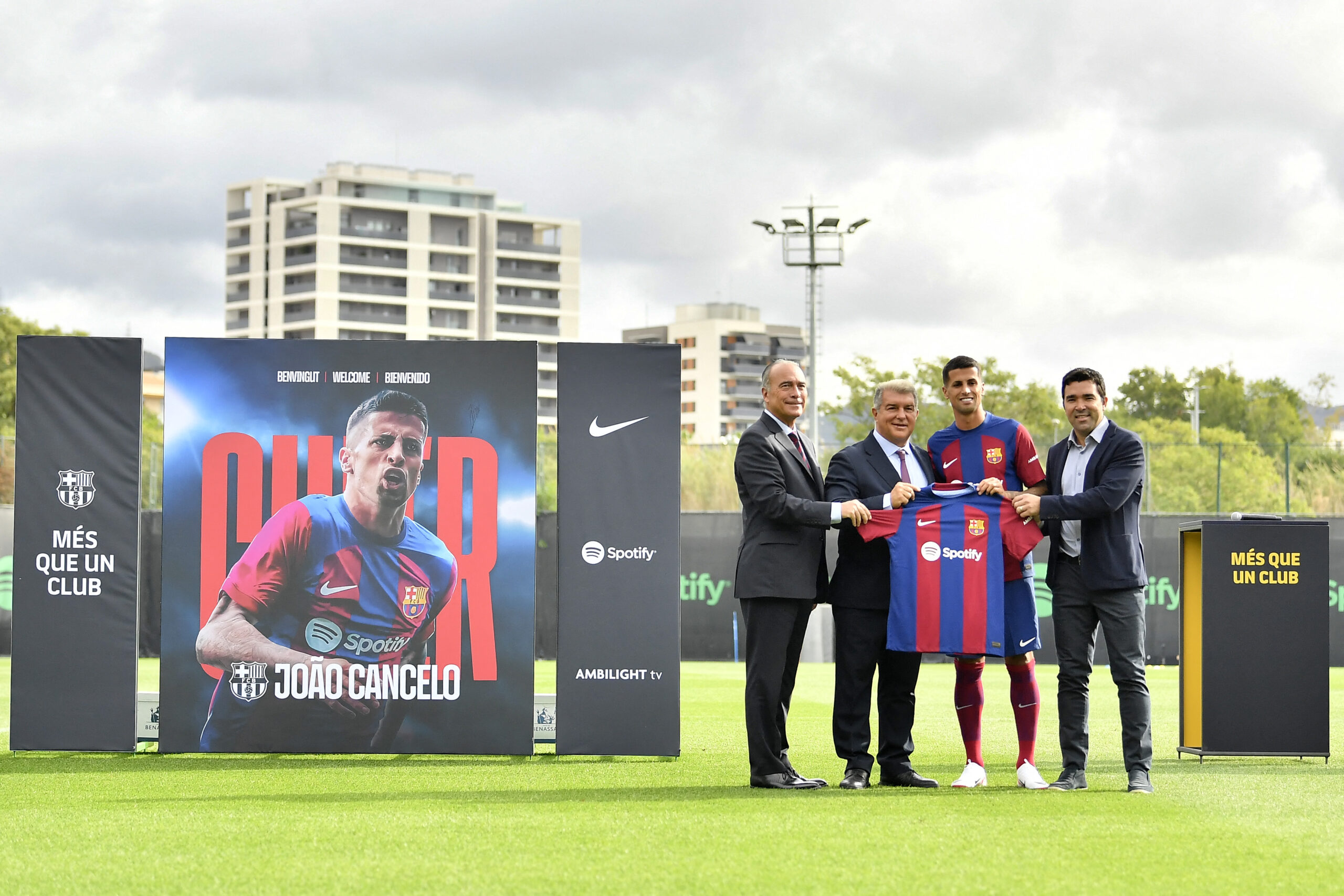 Portuguese defender Joao Cancelo (2R) pose with FC Barcelona president Joan Laporta (2L), vice-president Rafael Yuste (L) and sports director Anderson de Souza Deco (R), during his official presentation as new player of FC Barcelona at the Joan Gamper training ground in Sant Joan Despi, near Barcelona, on September 2, 2023.
