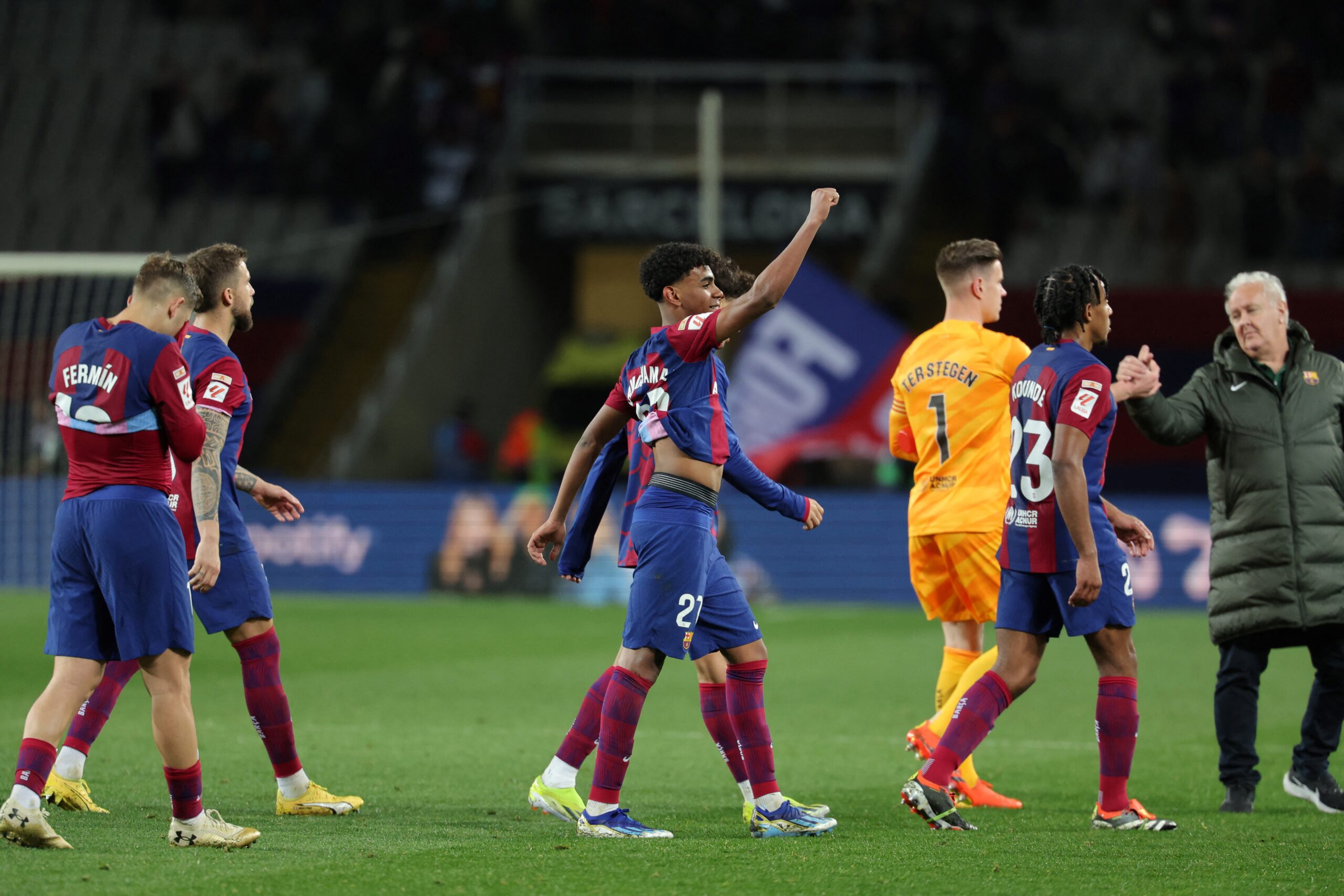 Barcelona's Spanish forward #27 Lamine Yamal (C) celebrates with teammates their victory at the end of the Spanish league football match between FC Barcelona and RCD Mallorca at the Estadi Olimpic Lluis Companys in Barcelona on March 8, 2024.