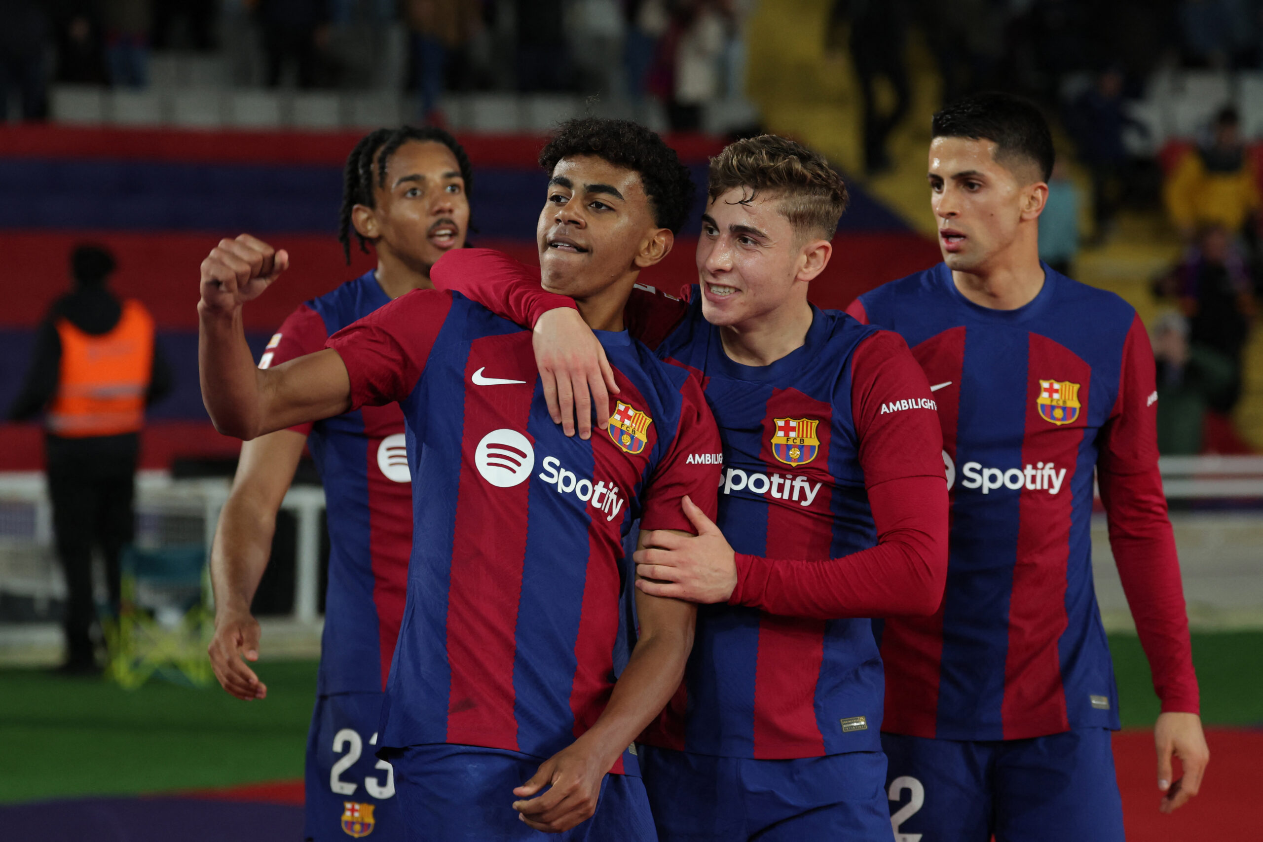 Barcelona's Spanish forward #27 Lamine Yamal (2n L) celebrates with teammates after scoring his team's first goal during the Spanish league football match between FC Barcelona and RCD Mallorca at the Estadi Olimpic Lluis Companys in Barcelona on March 8, 2024.