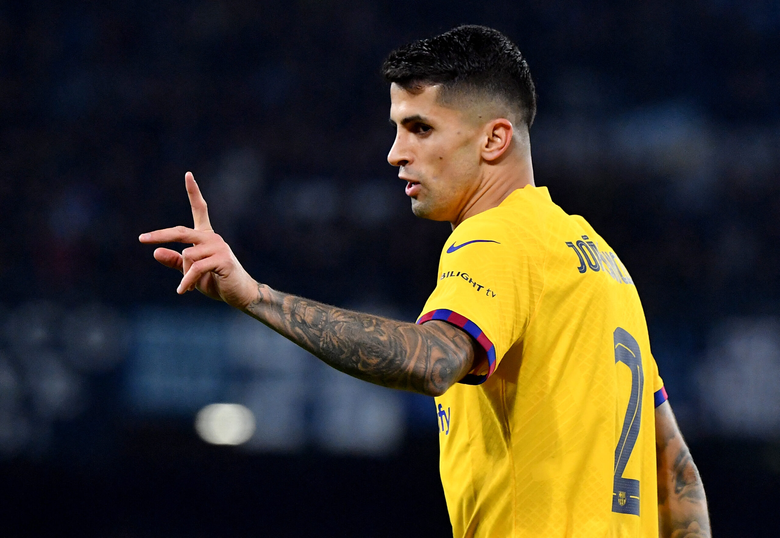 Barcelona's Portuguese defender #02 Joao Cancelo gestures during the UEFA Champions League round of 16 first Leg football match between Napoli and Barcelona at the Diego-Armando-Maradona stadium in Naples on February 21, 2024.