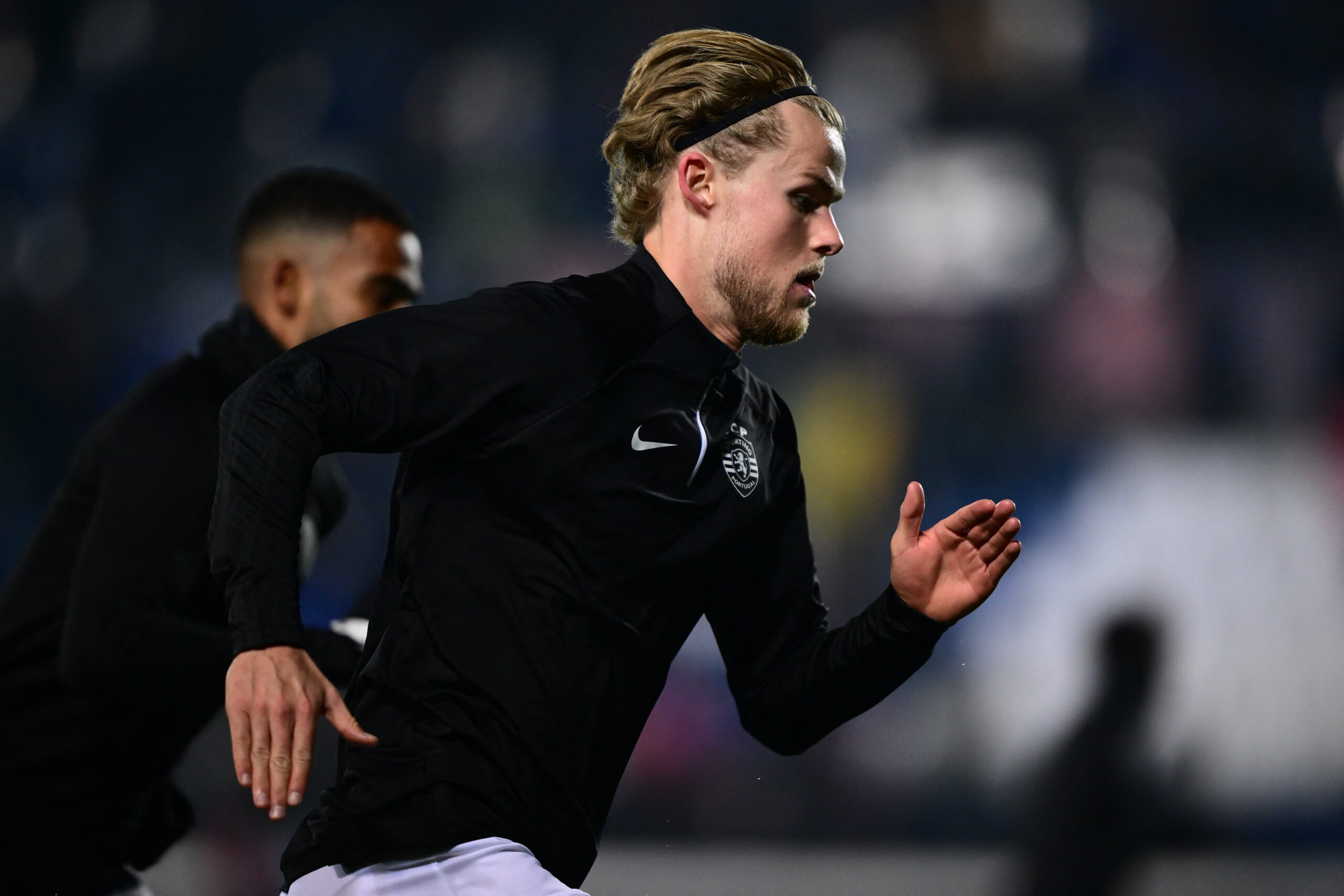 Sporting Lisbon's Danish midfielder #42 Morten Hjulmand warms up before the UEFA Europa League group D football match between Atalanta and Sporting Lisbon at the Gewiss Stadium in Bergamo on November 30, 2023.