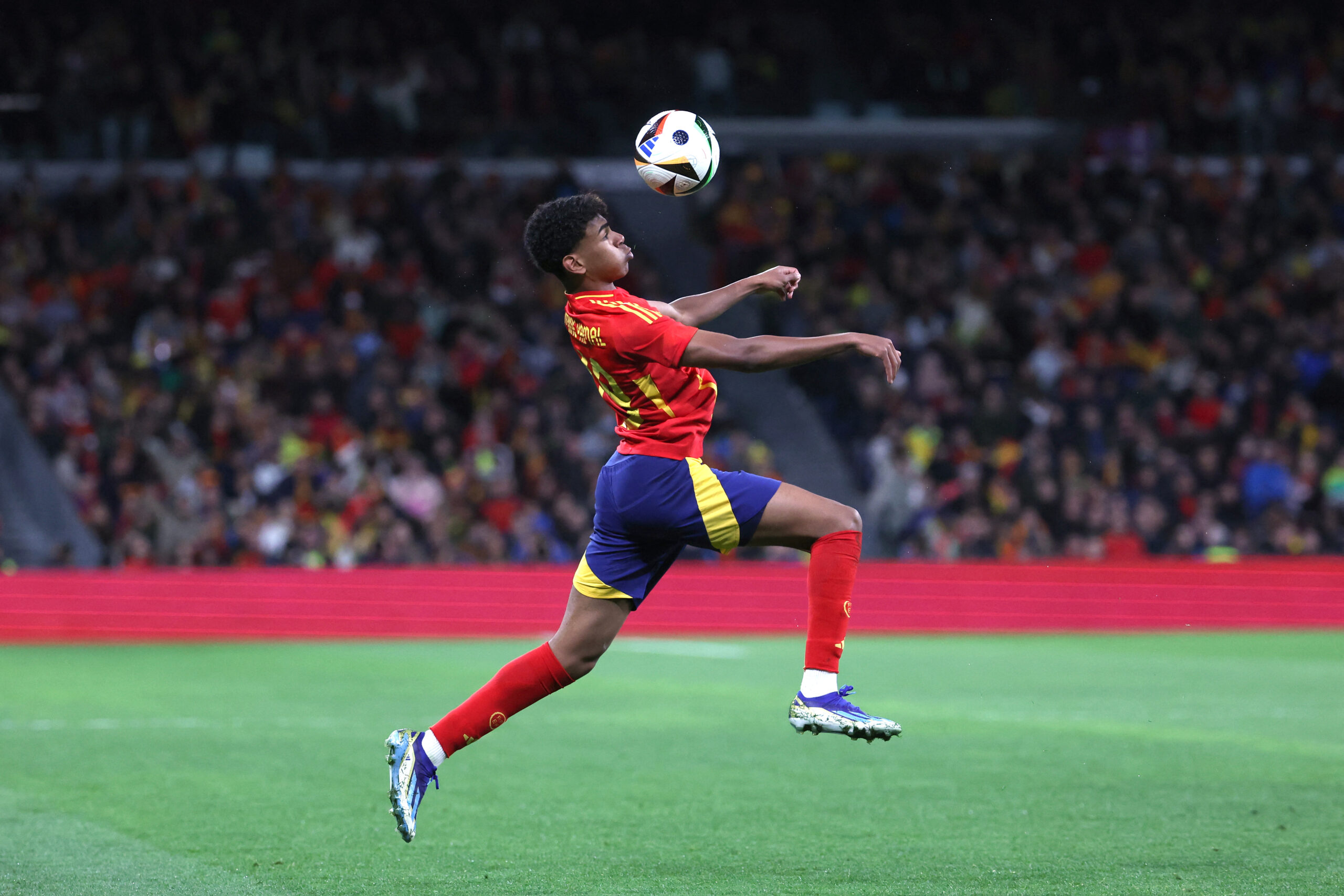 Spain's forward #19 Lamine Yamal controls the ball during the international friendly football match between Spain and Brazil at the Santiago Bernabeu stadium in Madrid, on March 26, 2024. Spain arranged a friendly against Brazil at the Santiago Bernabeu under the slogan "One Skin" to help combat racism. 