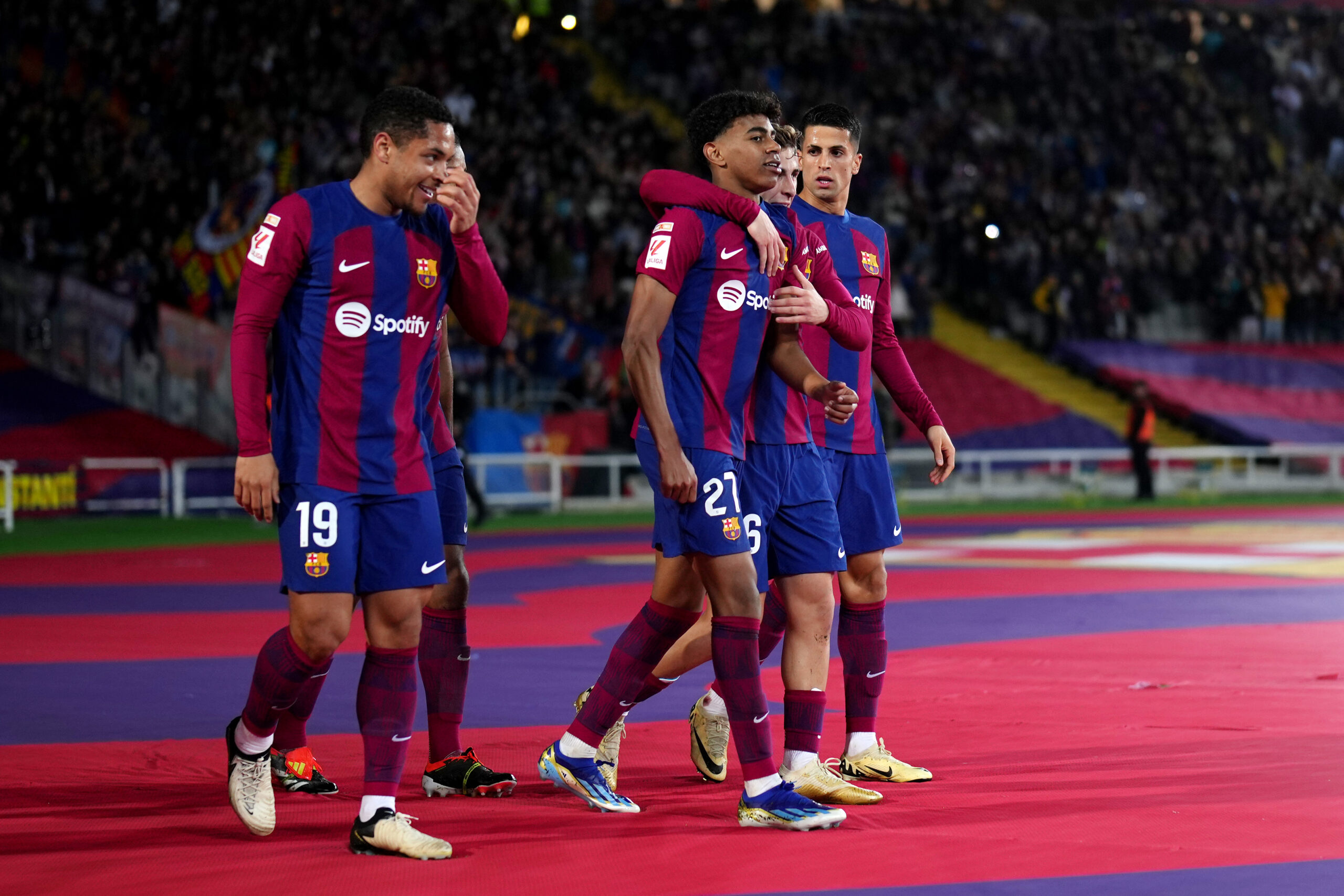 BARCELONA, SPAIN - MARCH 08: Lamine Yamal of FC Barcelona celebrates scoring his team's first goal with teammates during the LaLiga EA Sports match between FC Barcelona and RCD Mallorca at Estadi Olimpic Lluis Companys on March 08, 2024 in Barcelona, Spain.
