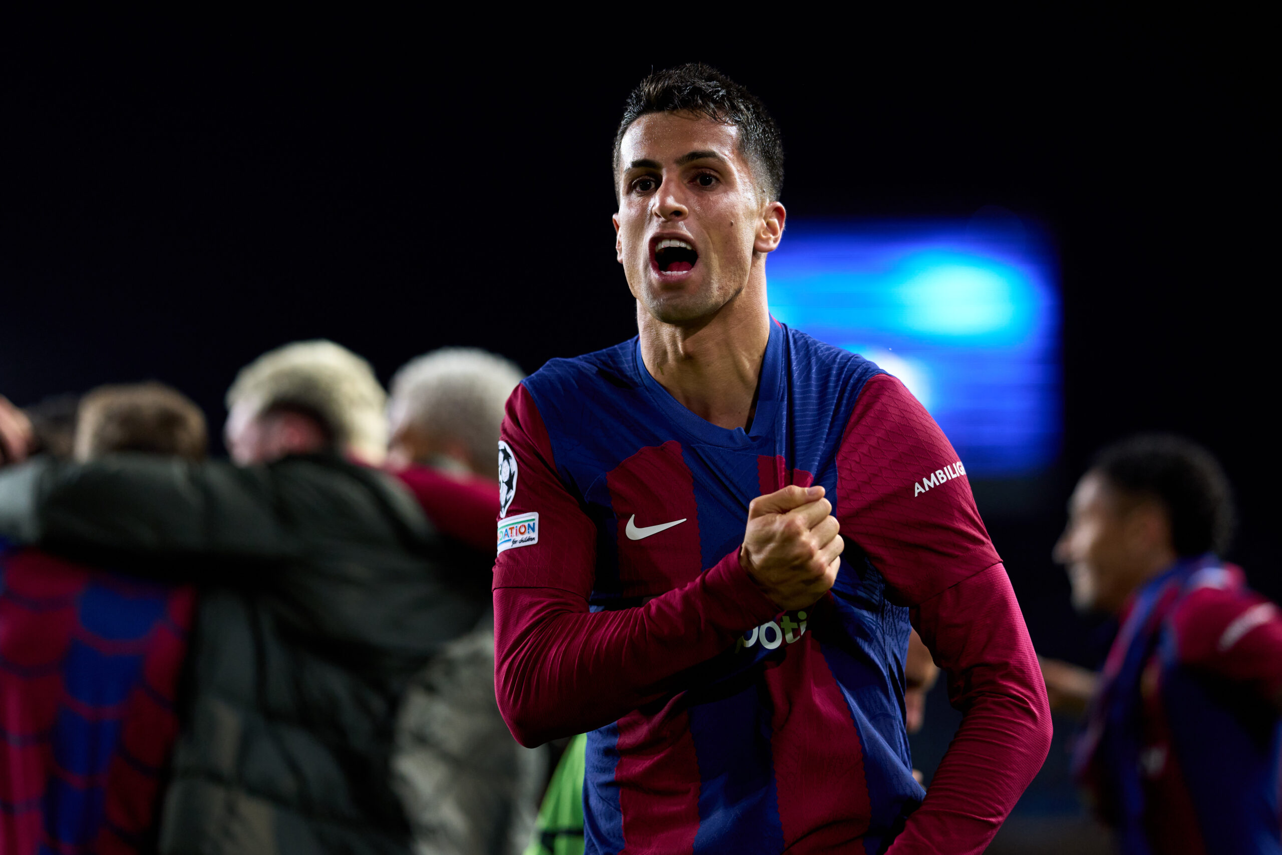 BARCELONA, SPAIN - MARCH 12: Joao Cancelo of FC Barcelona celebrates after his teammate Robert Lewandowski (not pictured) scored their team's third goal during the UEFA Champions League 2023/24 round of 16 second leg match between FC Barcelona and SSC Napoli at Estadi Olimpic Lluis Companys on March 12, 2024 in Barcelona, Spain.