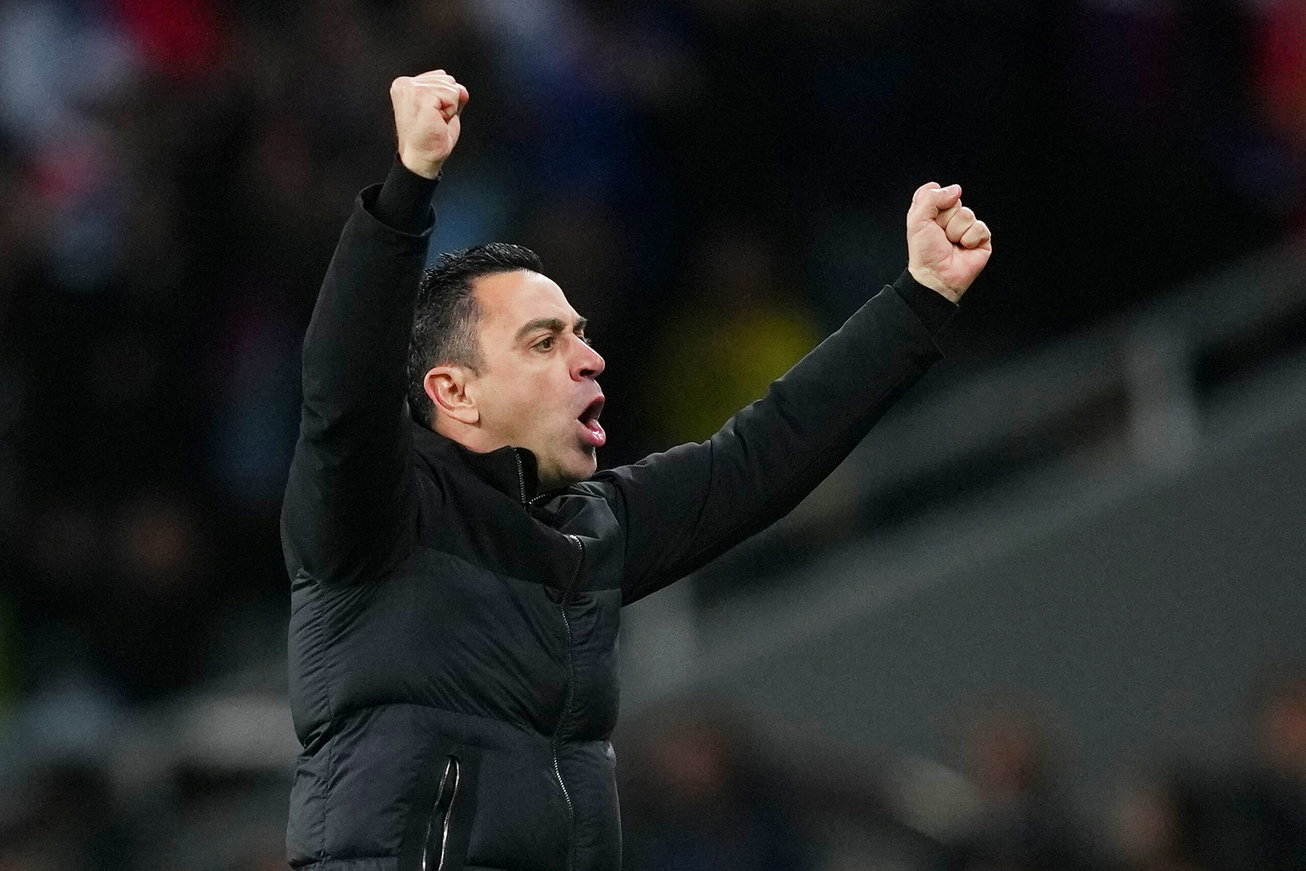 BARCELONA, SPAIN - MARCH 12: Xavi, Head Coach of FC Barcelona, celebrates after Fermin Lopez of FC Barcelona (not pictured) scores his team's first goal during the UEFA Champions League 2023/24 round of 16 second leg match between FC Barcelona and SSC Napoli at Estadi Olimpic Lluis Companys on March 12, 2024 in Barcelona, Spain.