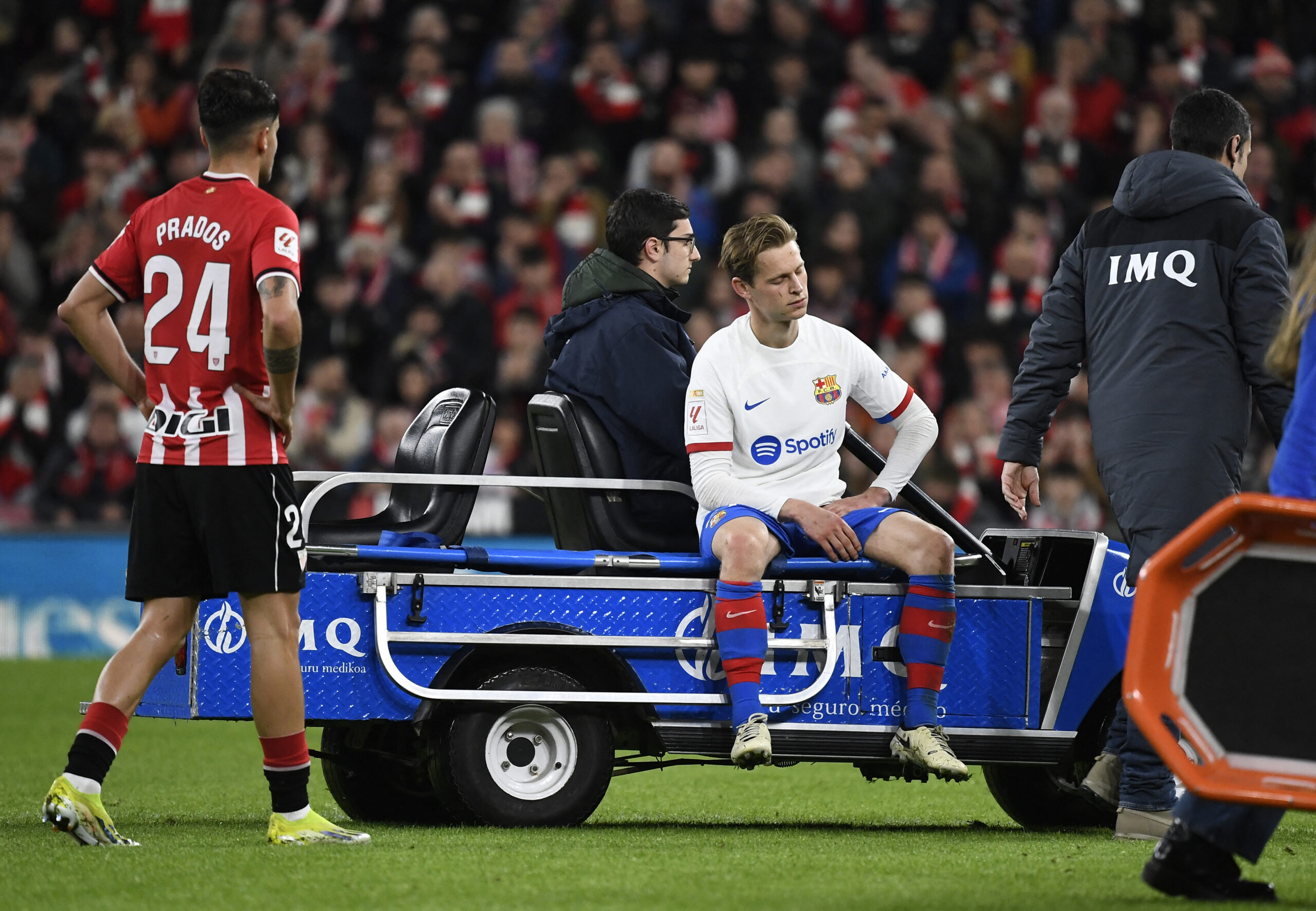 TOPSHOT - Barcelona's Dutch midfielder #21 Frenkie De Jong is carried off the pitch after resulting injured during the Spanish league football match between Athletic Club Bilbao and FC Barcelona at the San Mames stadium in Bilbao on March 3, 2024.
