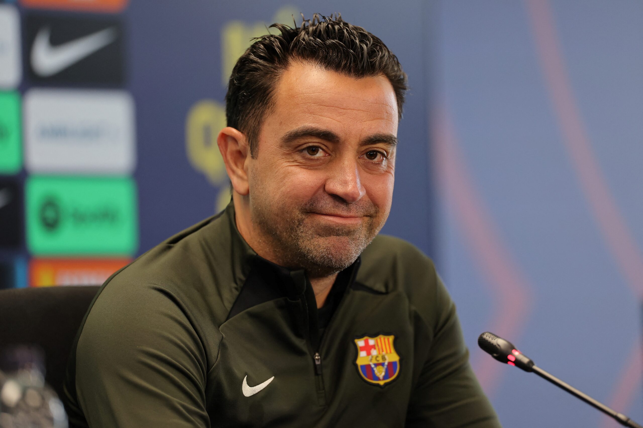 Barcelona's Spanish coach Xavi addresses a press conference at the Joan Gamper training ground in Sant Joan Despi, near Barcelona, on April 25, 2024. Xavi will remain as coach of Barcelona, the Spanish giants told AFP on April 24, despite having announced in January that he planned to quit at the end of the season due to the "cruel and unpleasant" nature of the job.