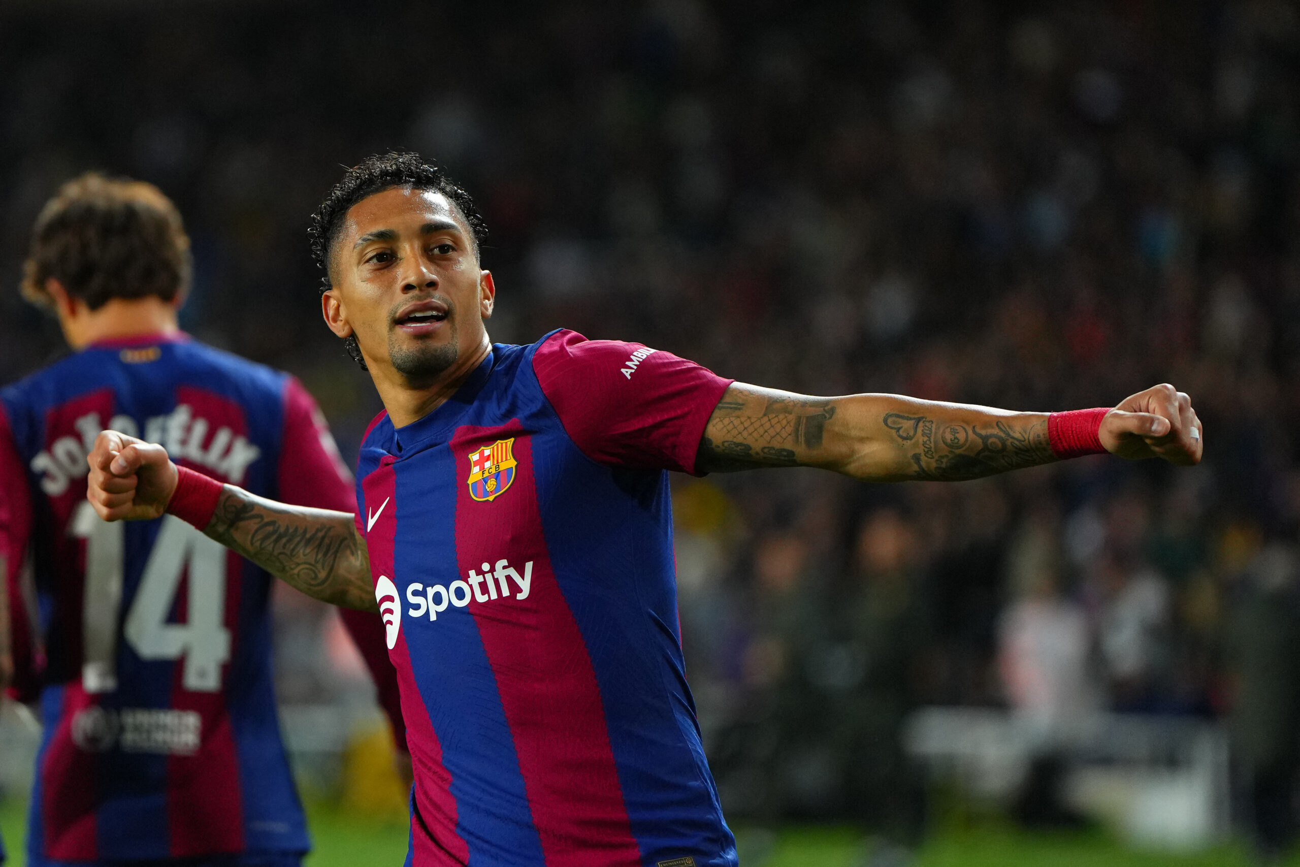 Barcelona's Brazilian forward #11 Raphinha celebrates after scoring his team's first goal during the Spanish league football match between FC Barcelona and UD Las Palmas at the Estadi Olimpic Lluis Companys in Barcelona on March 30, 2024.