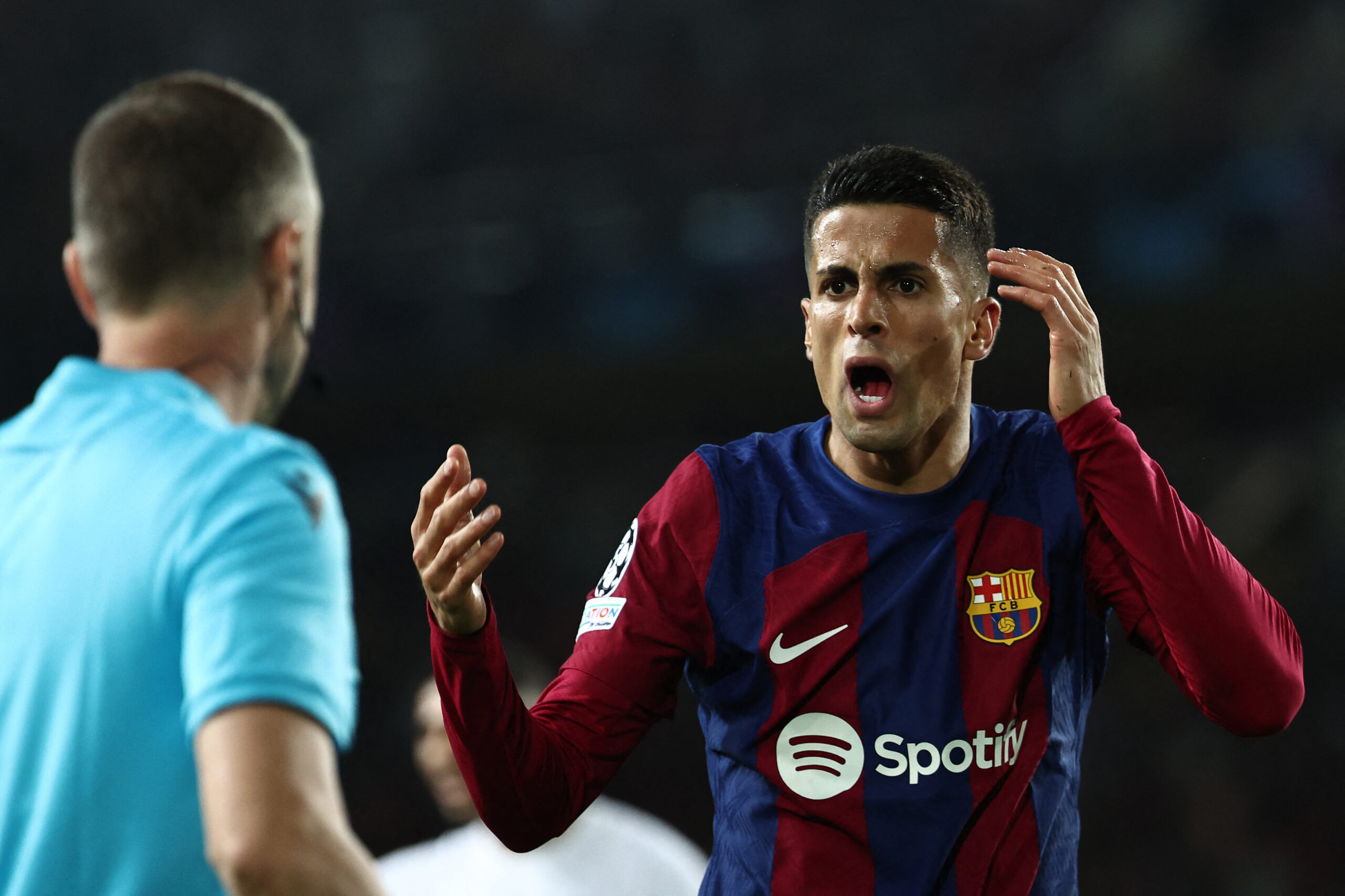 Barcelona's Portuguese defender #02 Joao Cancelo reacts during the UEFA Champions League quarter-final second leg football match between FC Barcelona and Paris SG at the Estadi Olimpic Lluis Companys in Barcelona on April 16, 2024.