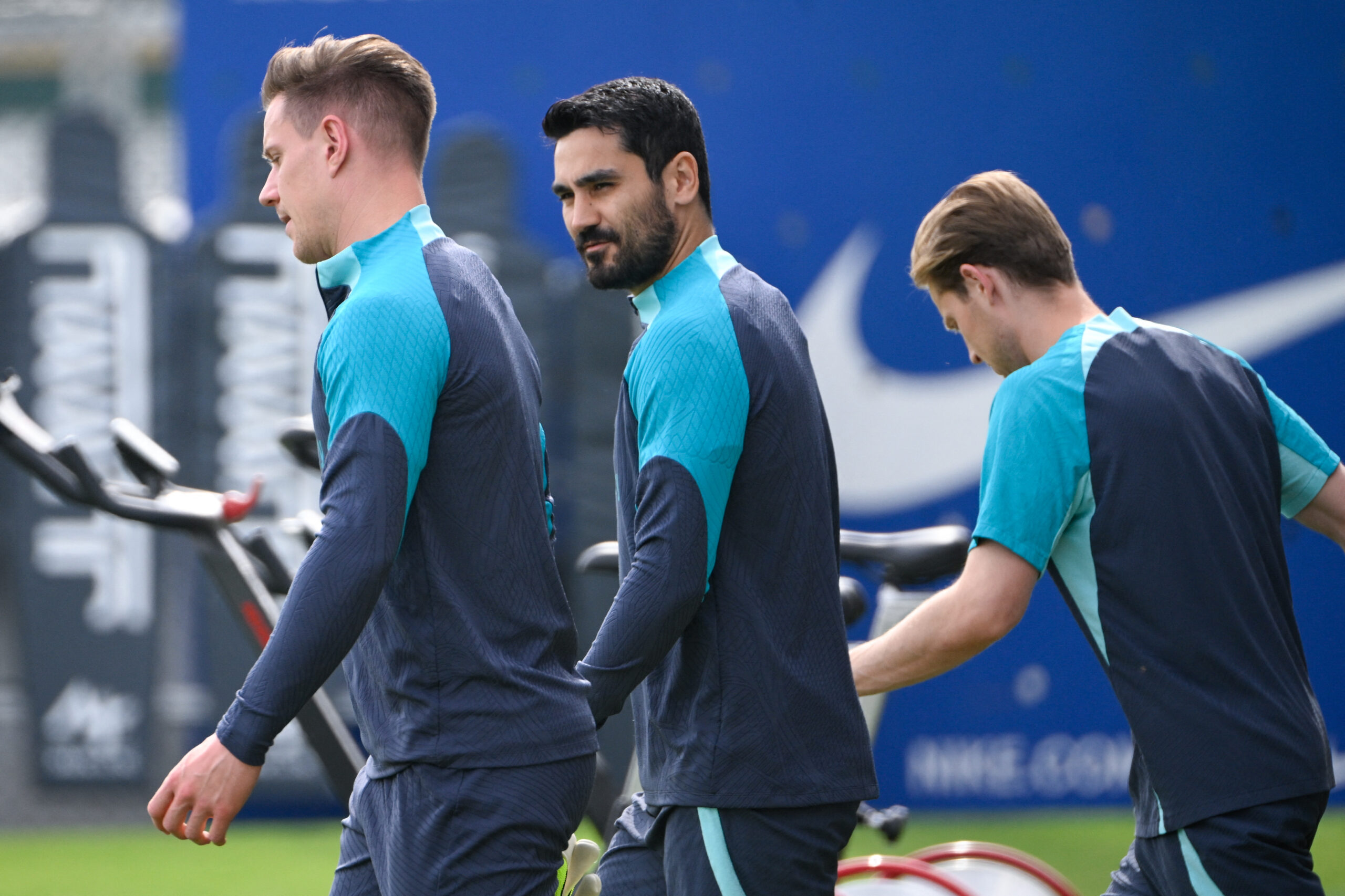 Barcelona's German midfielder #22 Ilkay Gundogan (C) and teammates arrive to a training session on the eve of their UEFA Champions League quarter-final second leg football match against Paris SG at the training center in Barcelona on April 15, 2024.