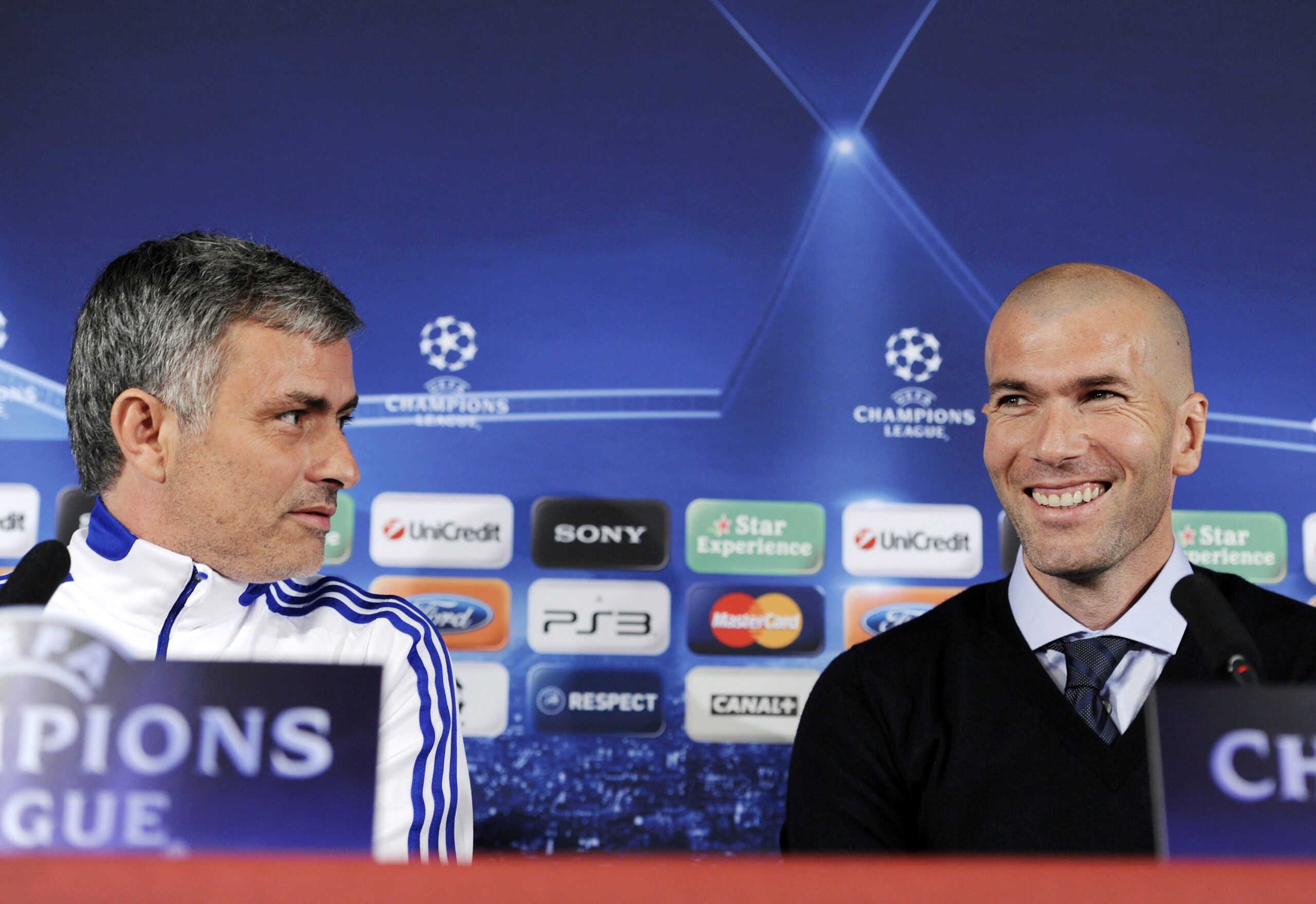 (FILES) This file picture dated February 21, 2011  shows former French football player Zinedine Zidane smiling next to Real Madrid's Portuguese coach Jose Mourinho (L) during a press conference on the eve of UEFA Champions league football match Lyon versus Real Madrid on at the Gerland stadium in Lyon.  Zidane annnced on July 7, 2011 that he has been named as Real Madrid's new sporting director for next season. 