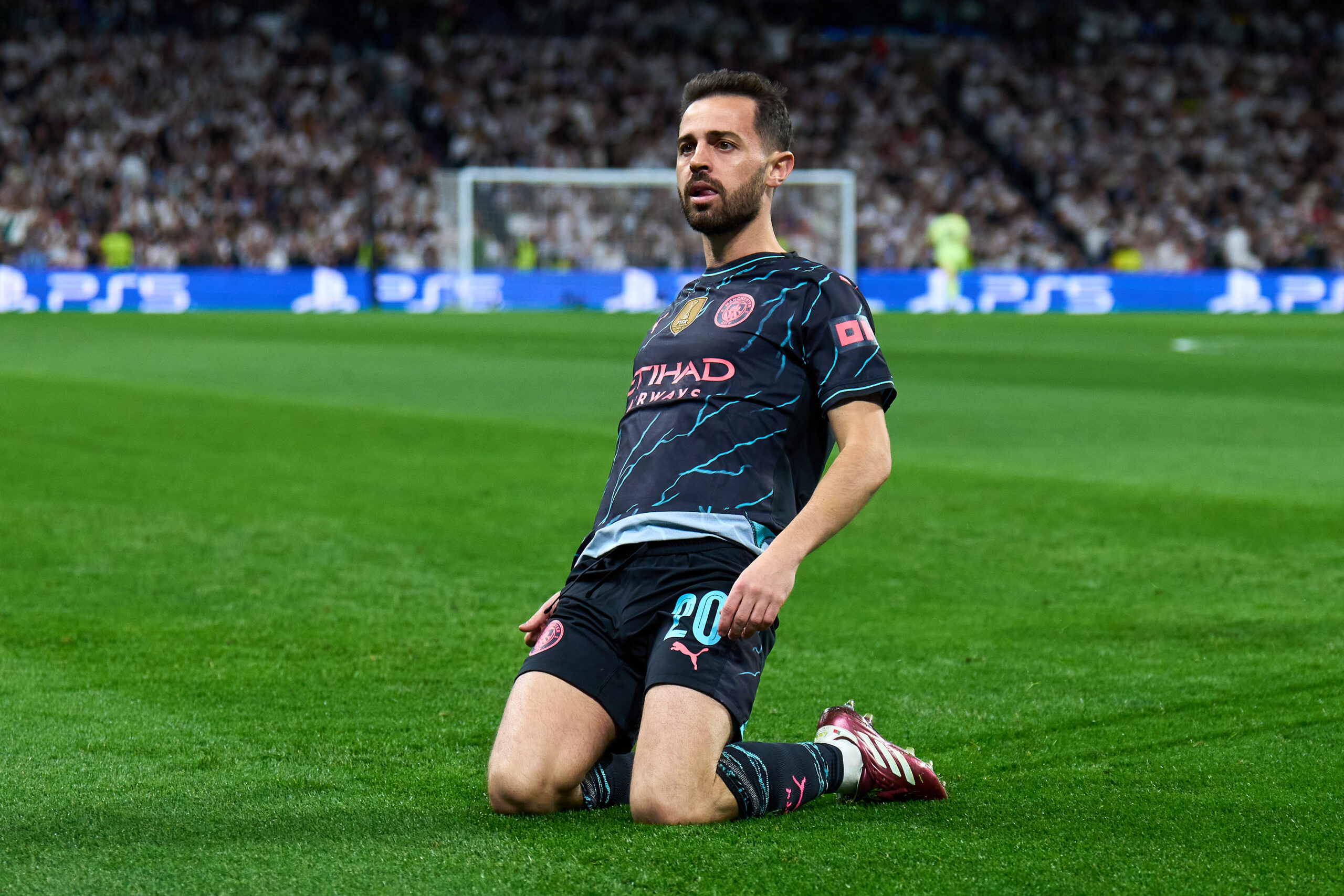 MADRID, SPAIN - APRIL 09: Bernardo Silva of Manchester City celebrates scoring his team's first goal during the UEFA Champions League quarter-final first leg match between Real Madrid CF and Manchester City at Estadio Santiago Bernabeu on April 09, 2024 in Madrid, Spain.