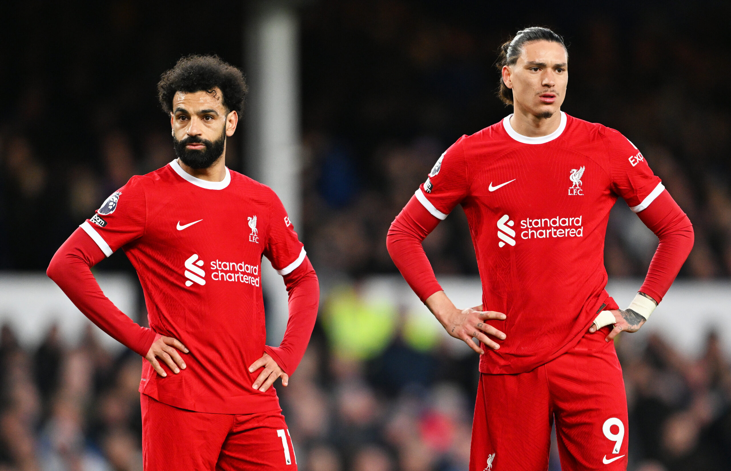 LIVERPOOL, ENGLAND - APRIL 24: Mohamed Salah and Darwin Nunez of Liverpool react as they look on during the Premier League match between Everton FC and Liverpool FC at Goodison Park on April 24, 2024 in Liverpool, England.