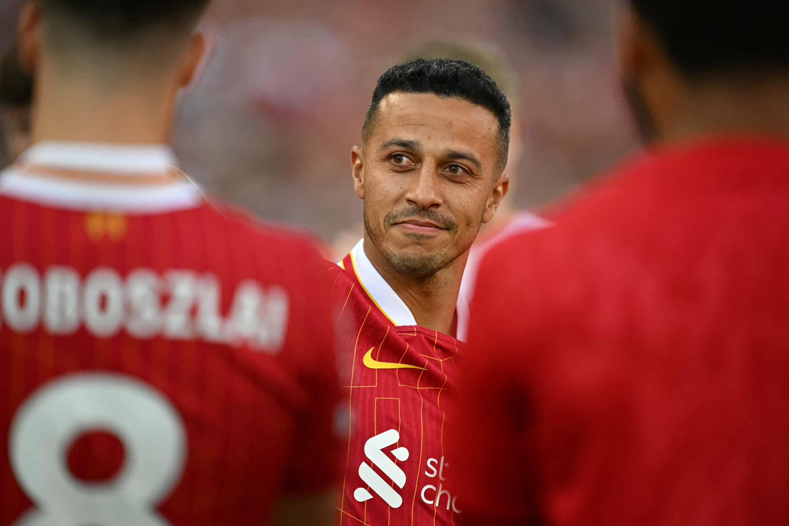 Liverpool's Spanish midfielder #06 Thiago Alcantara says goodbye to the fans after the English Premier League football match between Liverpool and Wolverhampton Wanderers at Anfield in Liverpool, north west England on May 19, 2024.