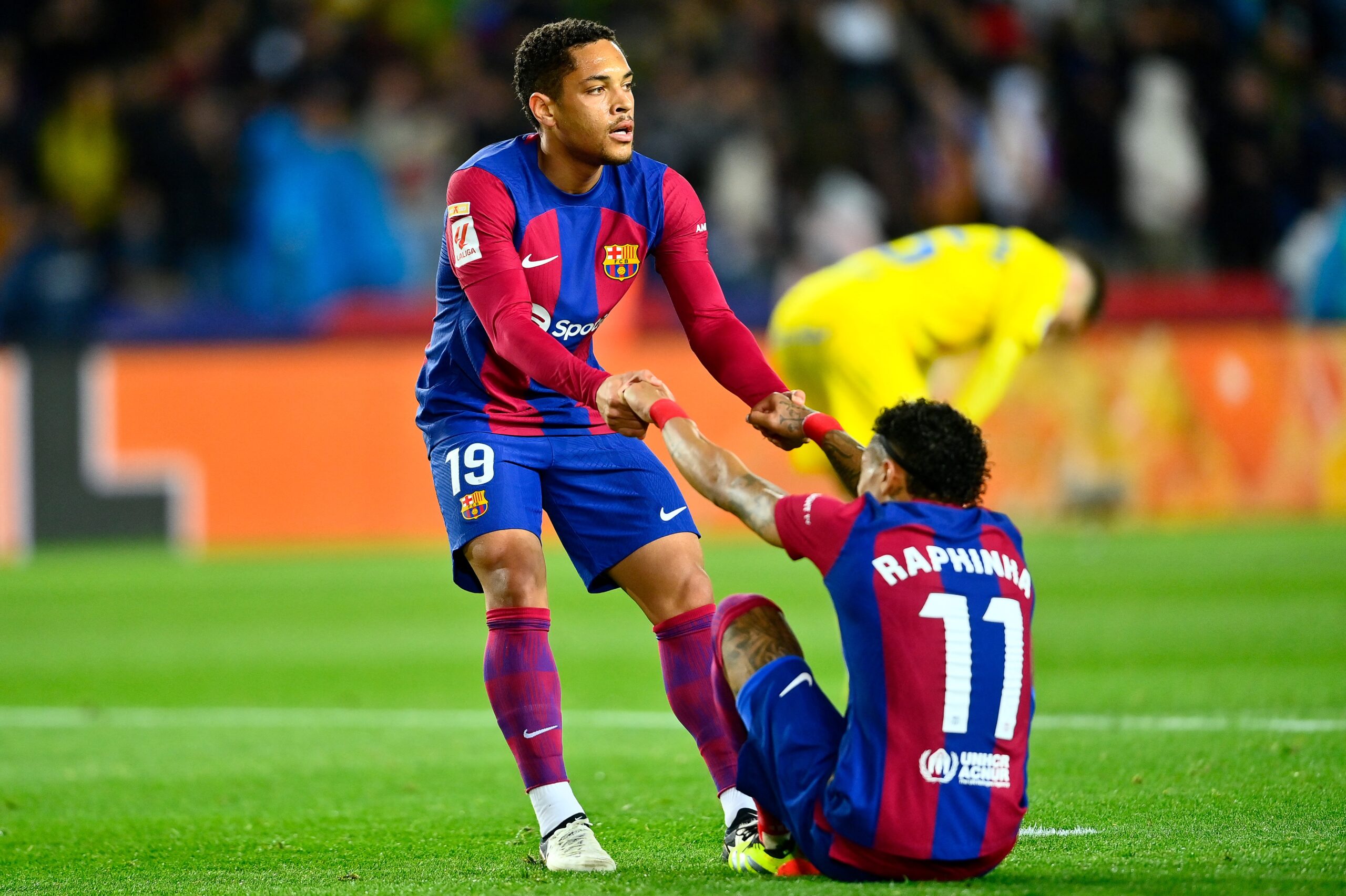Barcelona's Brazilian forward #19 Vitor Roque and Barcelona's Brazilian forward #11 Raphinha react at the end of the Spanish league football match between FC Barcelona and UD Las Palmas at the Estadi Olimpic Lluis Companys in Barcelona on March 30, 2024.
