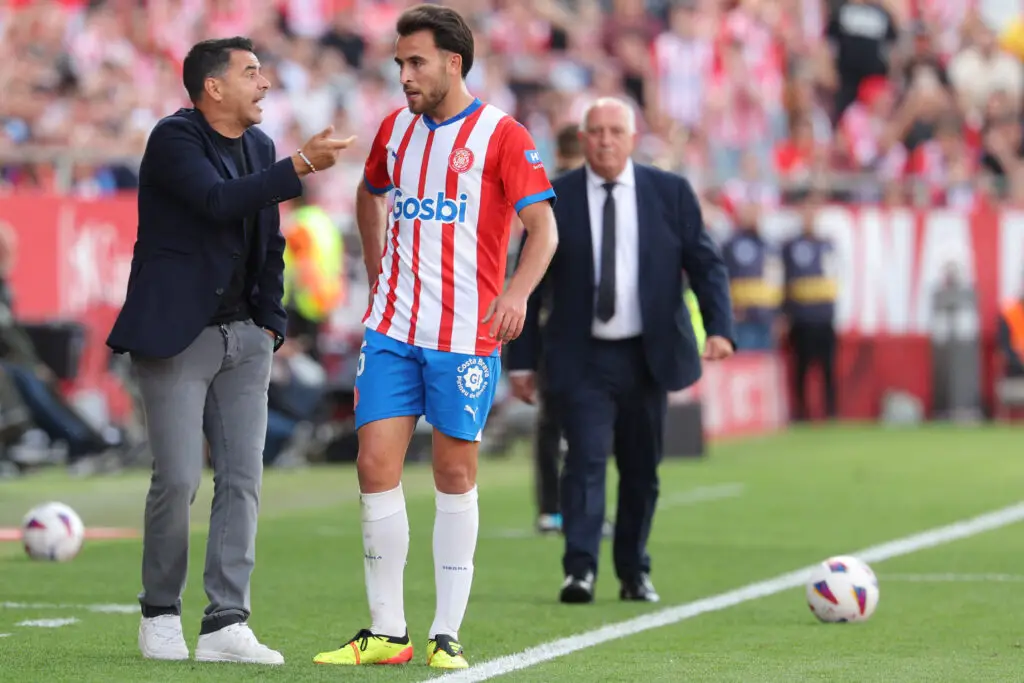 Girona's Spanish coach Michel talks to Girona's Spanish defender #25 Eric Garcia during the Spanish league football match between Girona FC and FC Barcelona at the Montilivi stadium in Girona on May 4, 2024.