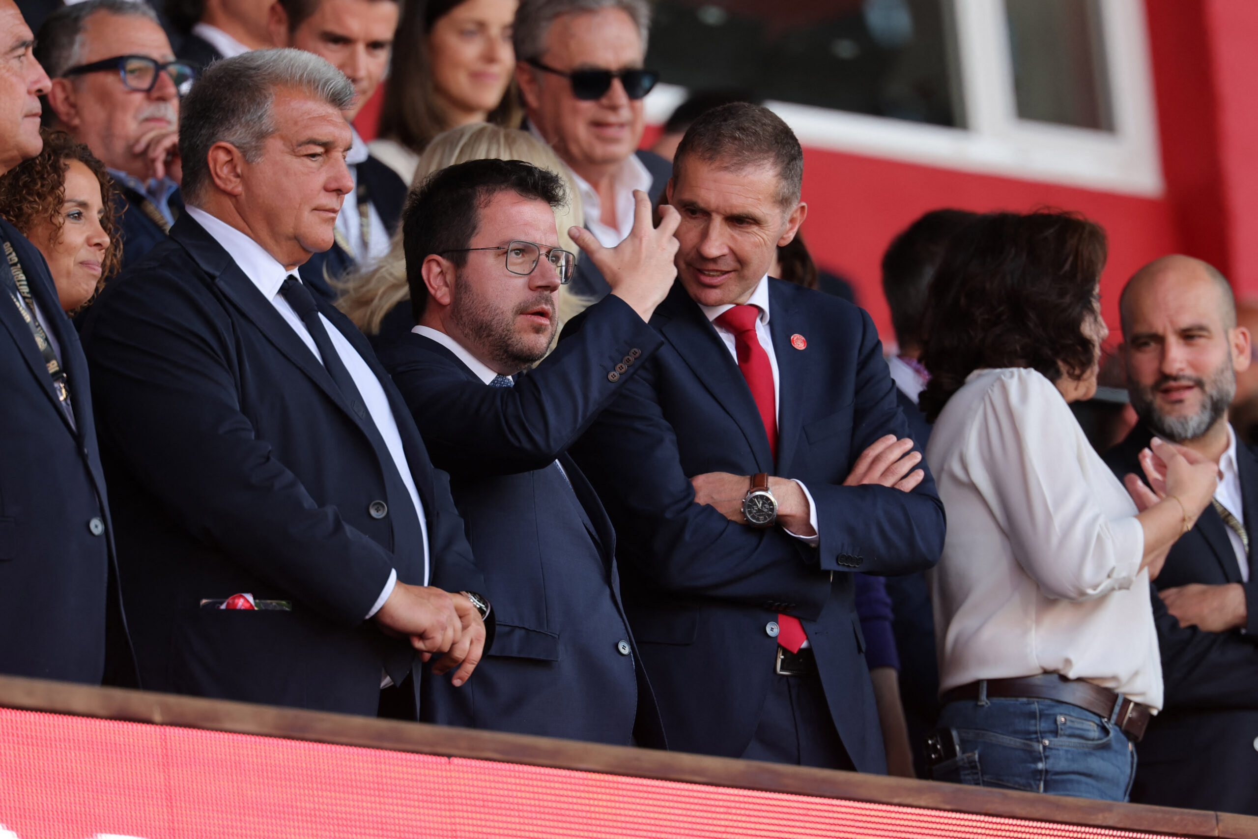 Catalonia's regional president Pere Aragones stands flanked by Barcelona's president Joan Laporta (L) and Girona's president Delfi Geli before the Spanish league football match between Girona FC and FC Barcelona at the Montilivi stadium in Girona on May 4, 2024.