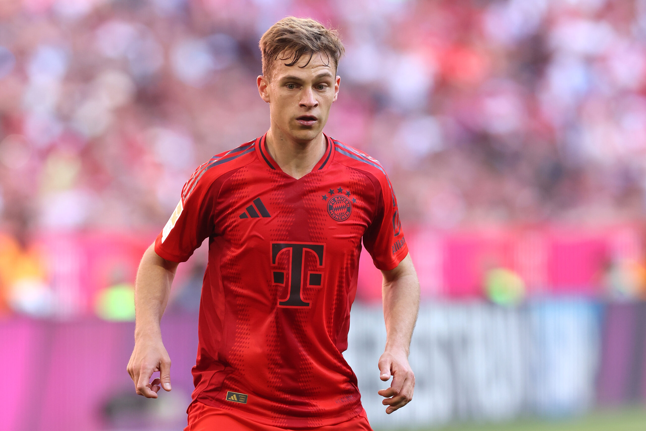 MUNICH, GERMANY - MAY 12: Joshua Kimmich of FC Bayern München looks on during the Bundesliga match between FC Bayern München and VfL Wolfsburg at Allianz Arena on May 12, 2024 in Munich, Germany.