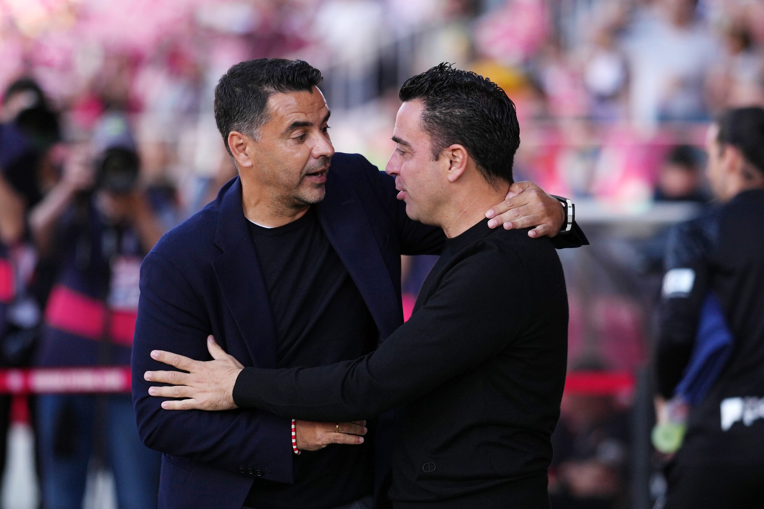 GIRONA, SPAIN - MAY 04: Michel, Head Coach of Girona FC, embraces during the LaLiga EA Sports match between Girona FC and FC Barcelona at Montilivi Stadium on May 04, 2024 in Girona, Spain.