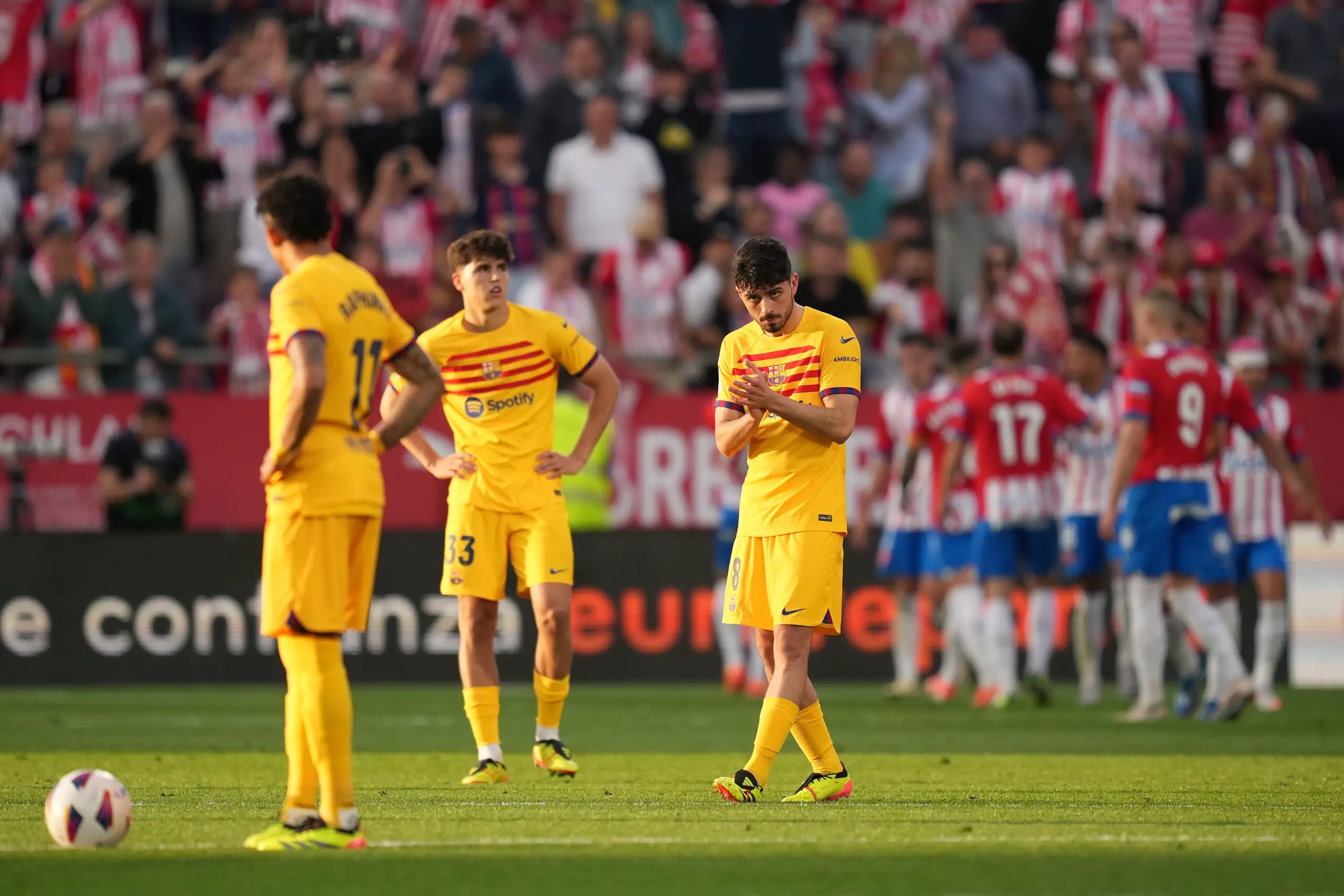 GIRONA, SPAIN - MAY 04: Pedri of FC Barcelona reacts after Portu of Girona FC (obscured) scores his team's fourth goal during the LaLiga EA Sports match between Girona FC and FC Barcelona at Montilivi Stadium on May 04, 2024 in Girona, Spain.
