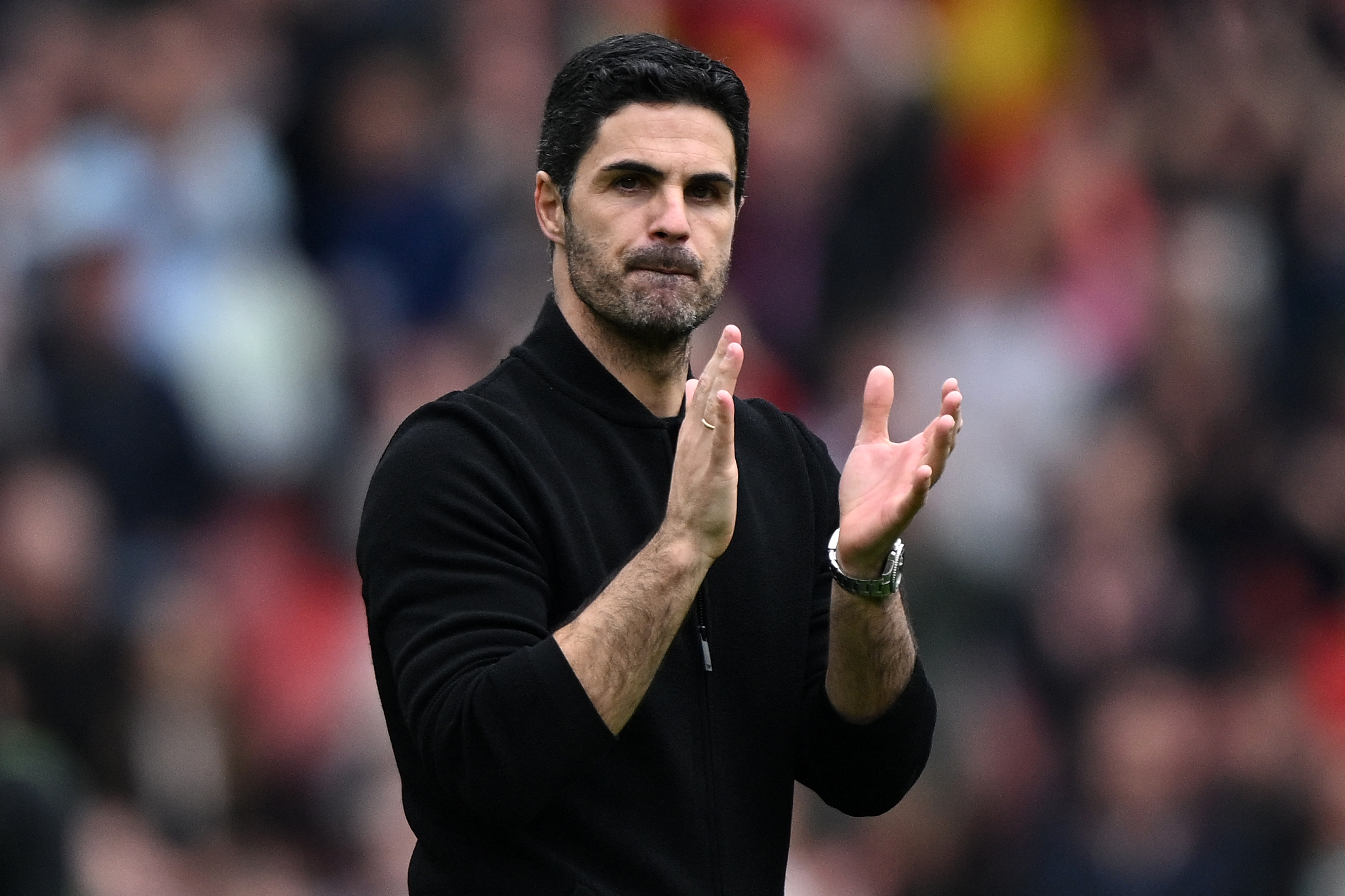 Arsenal's Spanish manager Mikel Arteta applauds the fans following the English Premier League football match between Arsenal and Bournemouth at the Emirates Stadium, in London, on May 4, 2024. Arsenal won the match 3-0.