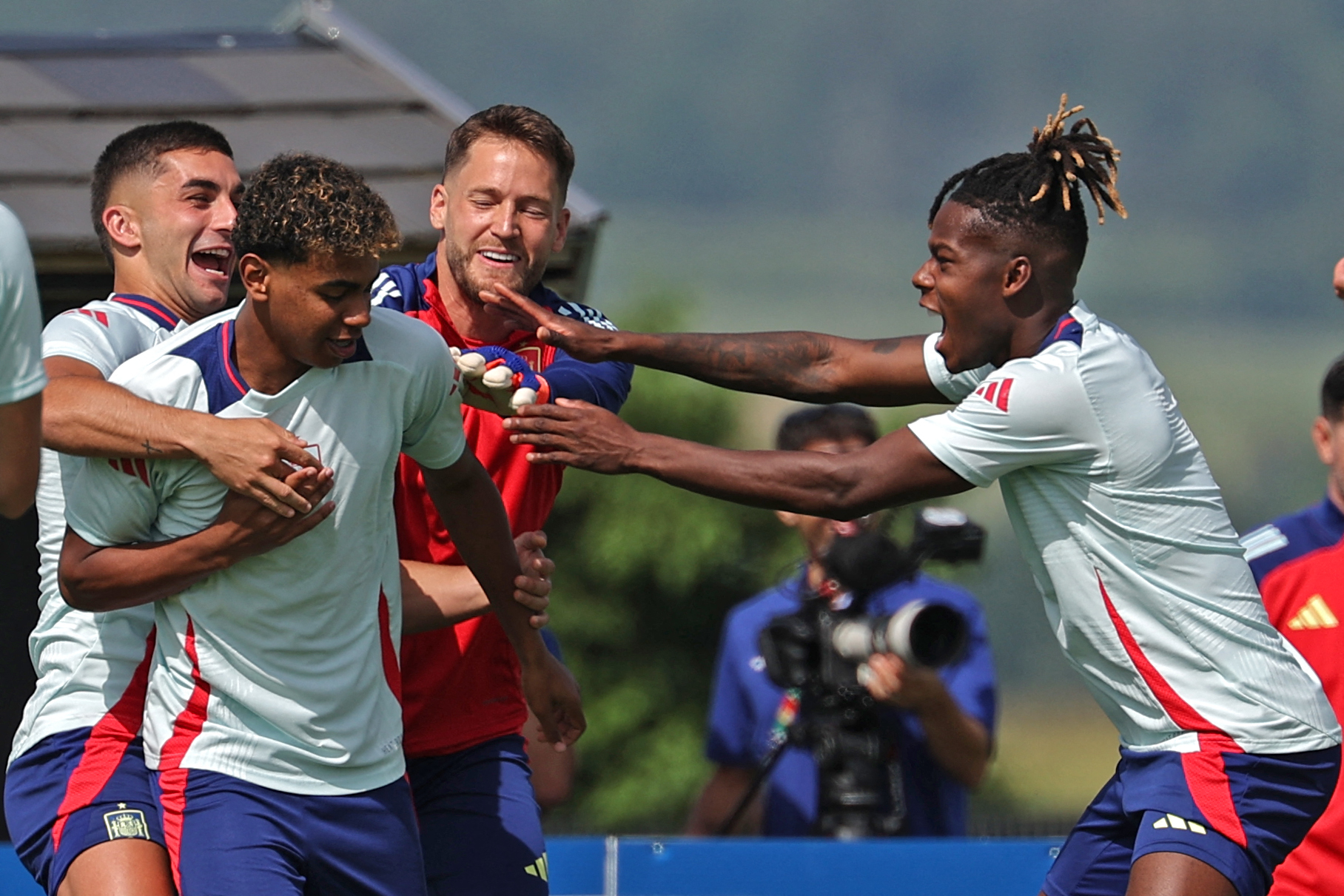 Spain's forward #19 Lamine Yamal (2L) and midfielder #17 Nico Williams (R) along with their teammates attend a training session at the team's base camp in Donaueschingen on June 29, 2024, on the eve of their UEFA Euro 2024 Round of 16 football match against Georgia.