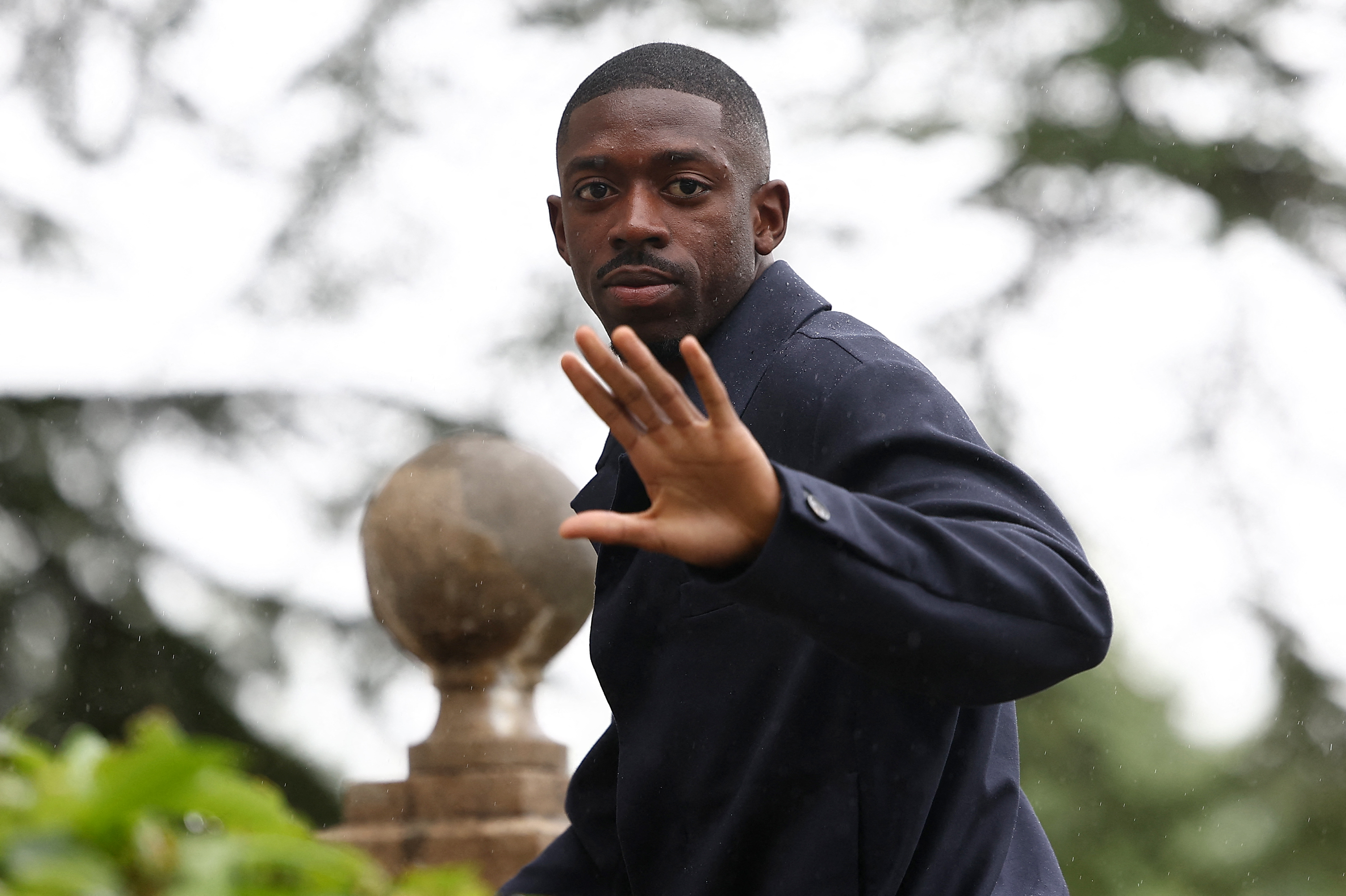 France's forward Ousmane Dembele arrives to the national team's training camp for the upcoming UEFA Euro 2024 European Football Championship, in Clairefontaine-en-Yvelines on May 29, 2024.
