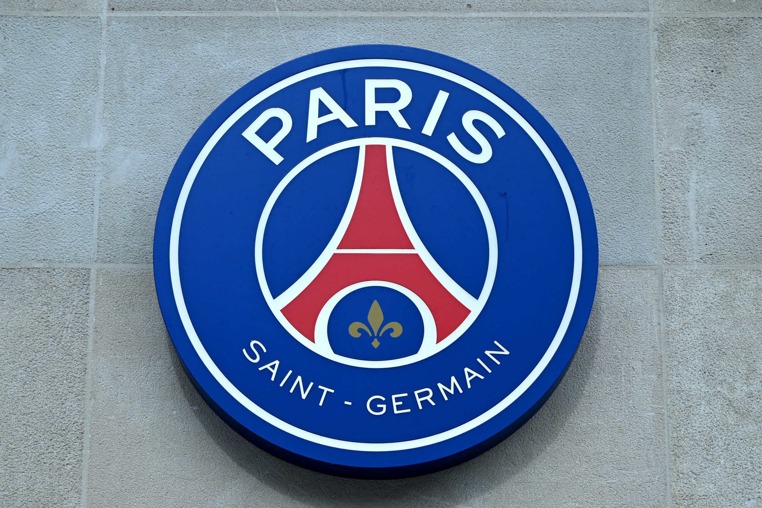 The logo of the Paris Saint-Germain football club is seen on the facade of a shop on the Champs-Elysees in Paris on March 11, 2024.