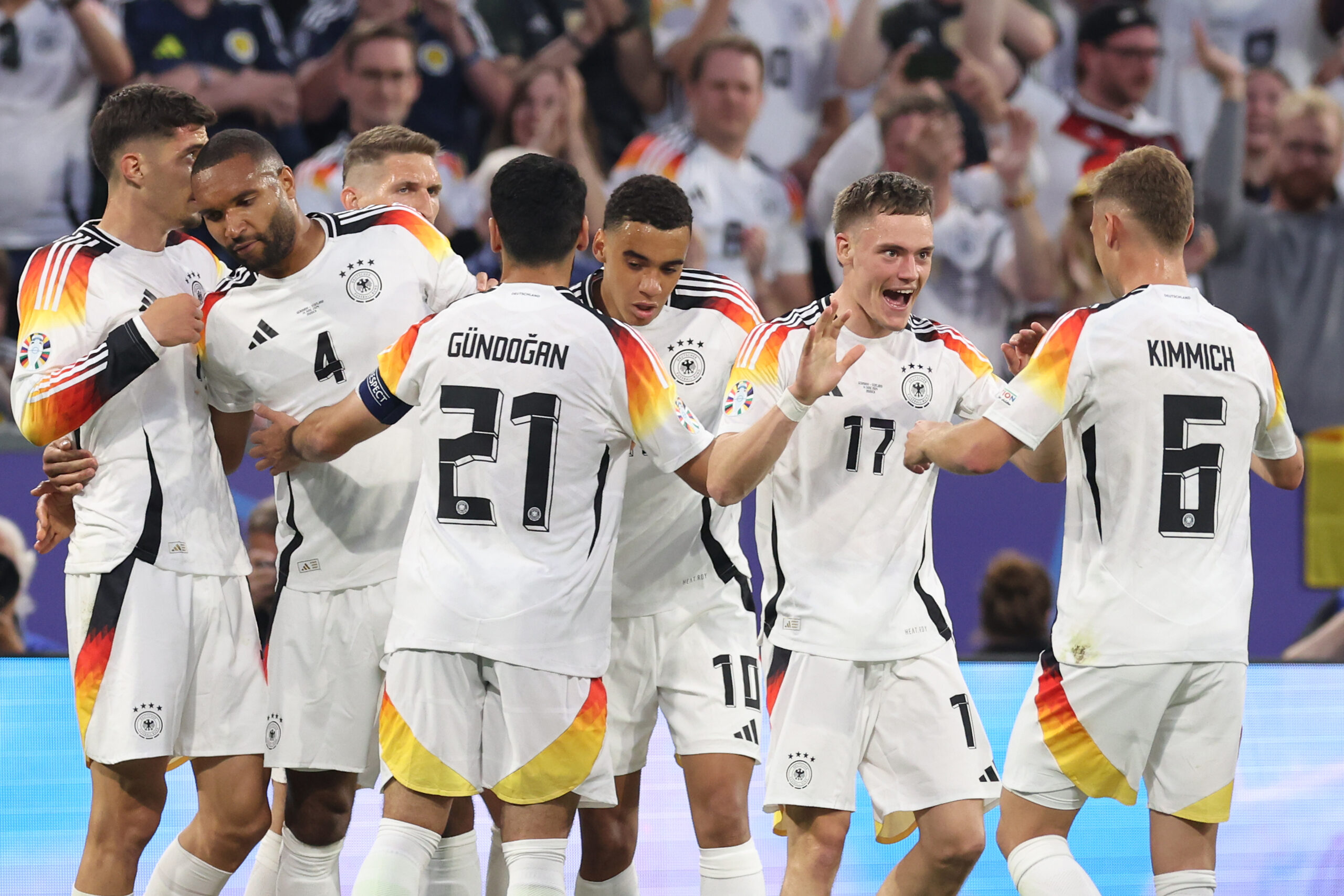 MUNICH, GERMANY - JUNE 14: Florian Wirtz of Germany celebrates with teammates after scoring his team's first goal during the UEFA EURO 2024 group stage match between Germany and Scotland at Munich Football Arena on June 14, 2024 in Munich, Germany.