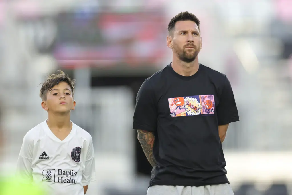 FORT LAUDERDALE, FLORIDA - MAY 24: Lionel Messi stands alongside Thiago Messi during the Youth International Cup Opening Ceremony match at Chase Stadium on May 24, 2024 in Fort Lauderdale, Florida.