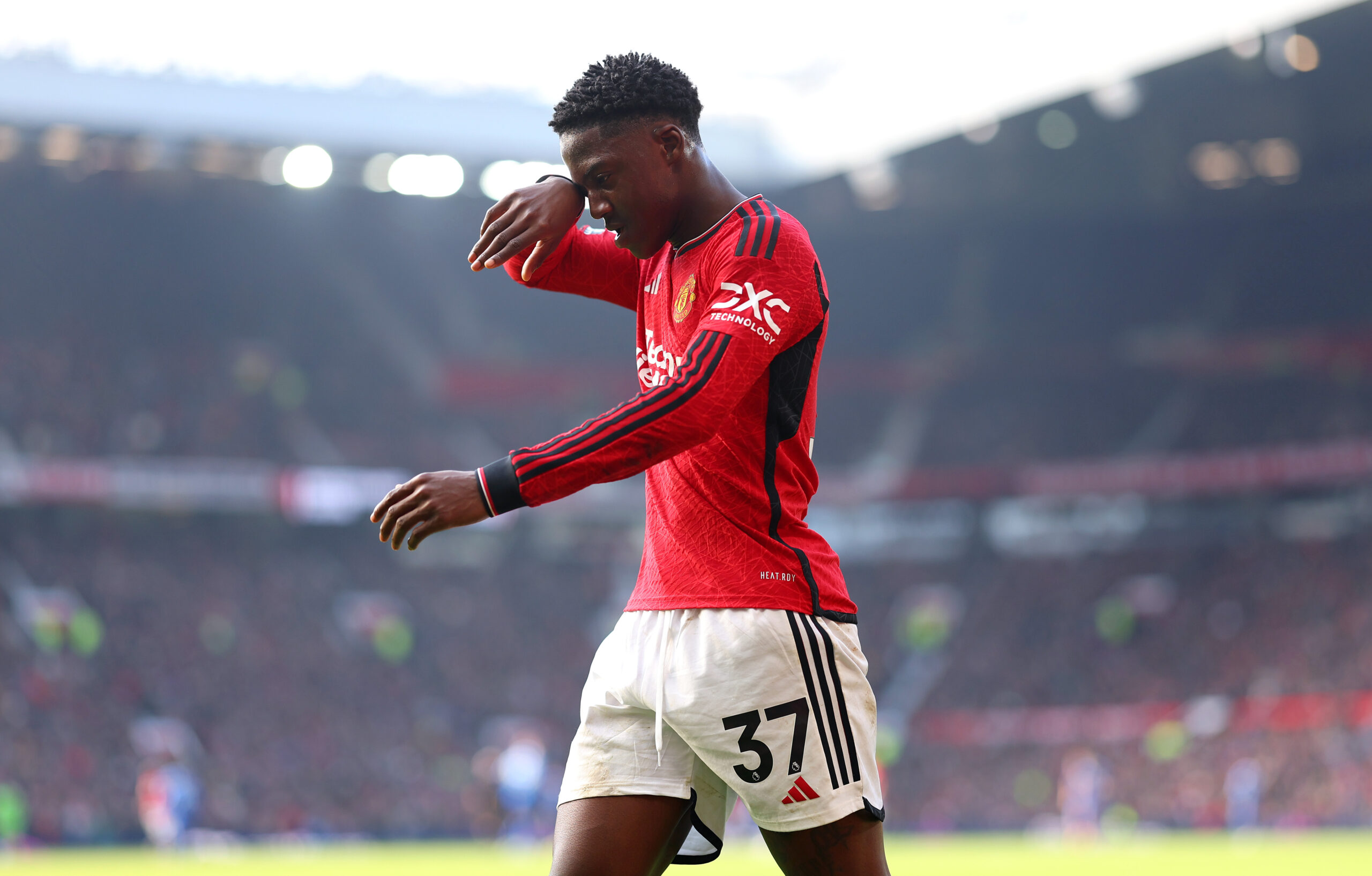 MANCHESTER, ENGLAND - MARCH 09: Kobbie Mainoo of Manchester United leaves the pitch after being substituted during the Premier League match between Manchester United and Everton FC at Old Trafford on March 09, 2024 in Manchester, England.