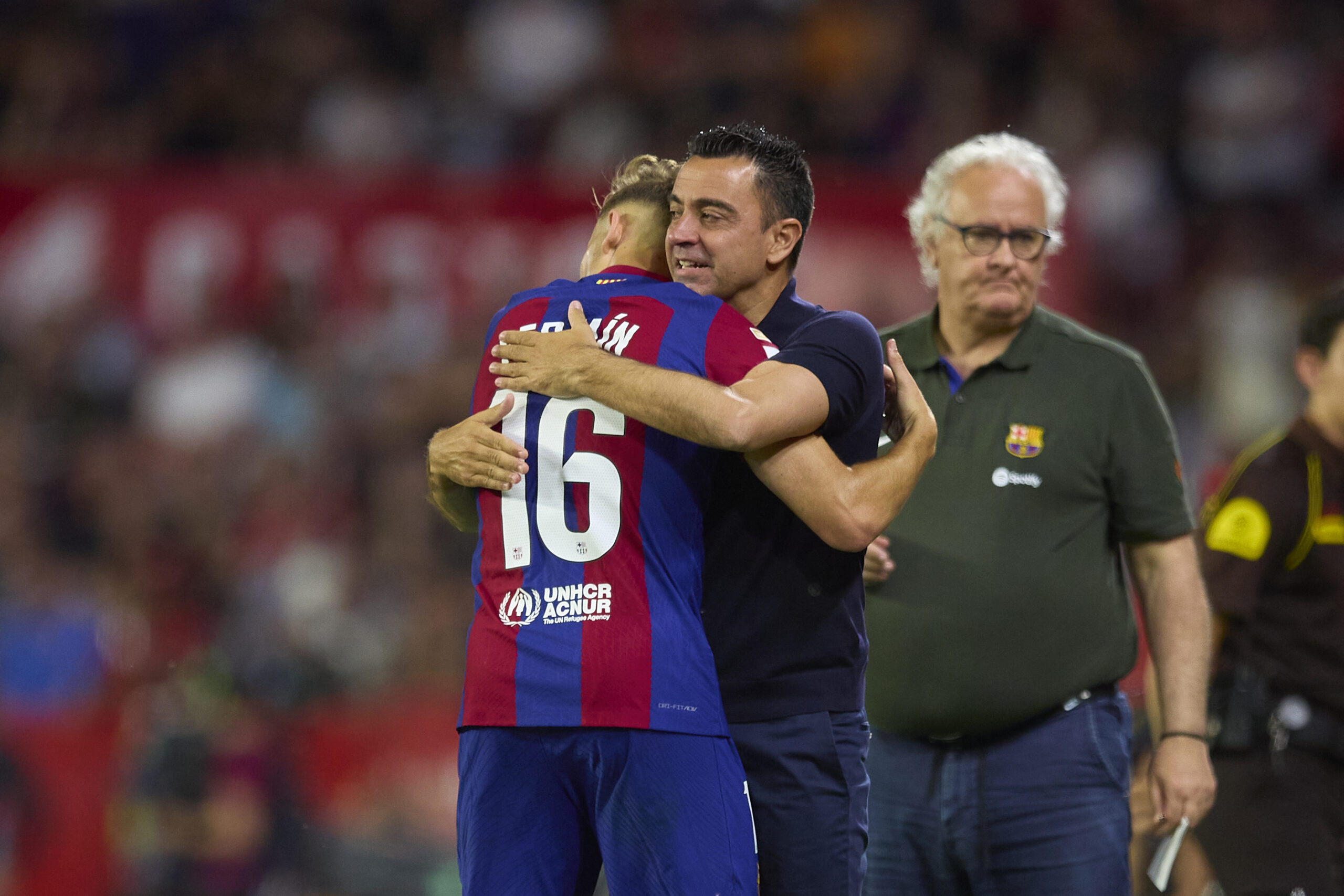 SEVILLE, SPAIN - MAY 26: Fermin Lopez of FC Barcelona celebrates after scoring the teams second goal with Xavi, Head Coach of FC Barcelona, during the LaLiga EA Sports match between Sevilla FC and FC Barcelona at Estadio Ramon Sanchez Pizjuan on May 26, 2024 in Seville, Spain.