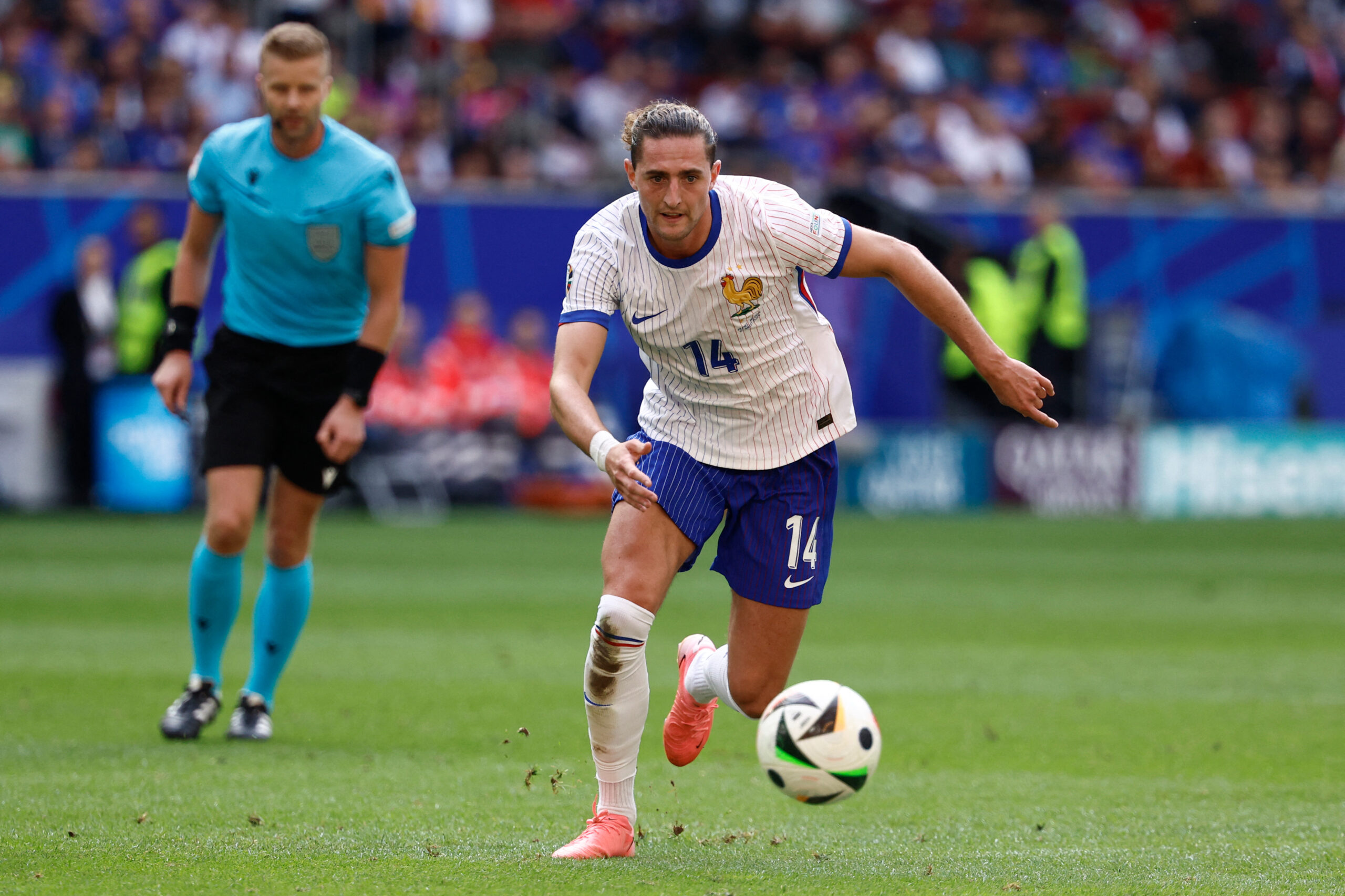 France's midfielder #14 Adrien Rabiot runs with the ball during the UEFA Euro 2024 round of 16 football match between France and Belgium at the Duesseldorf Arena in Duesseldorf on July 1, 2024.